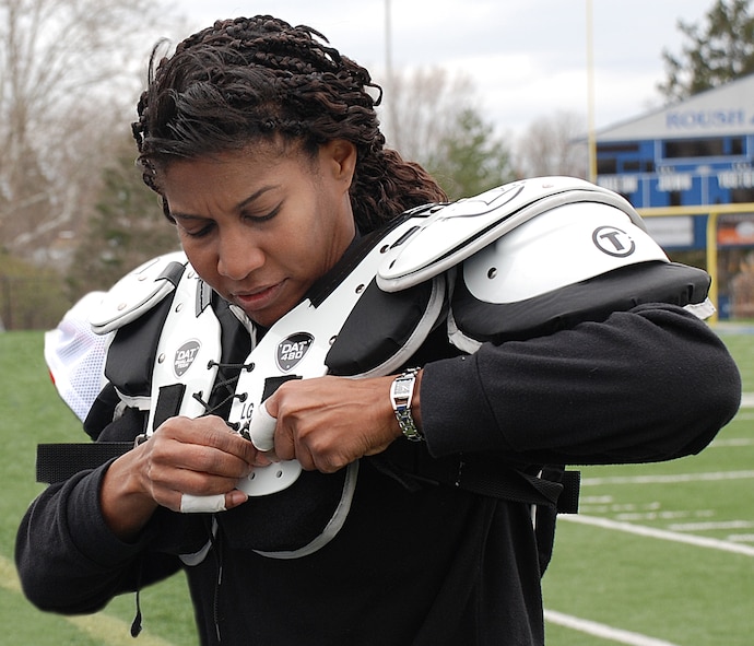 Student researcher Robyn Bradford of the 711th Human Performance Wing's Human Effectiveness Directorate suits up April 11 in preparation for the Dayton Diamonds' first full-contact intrasquad scrimmage on their Roush Stadium home field. (Photo by Chris Gulliford AFRL/RH)
