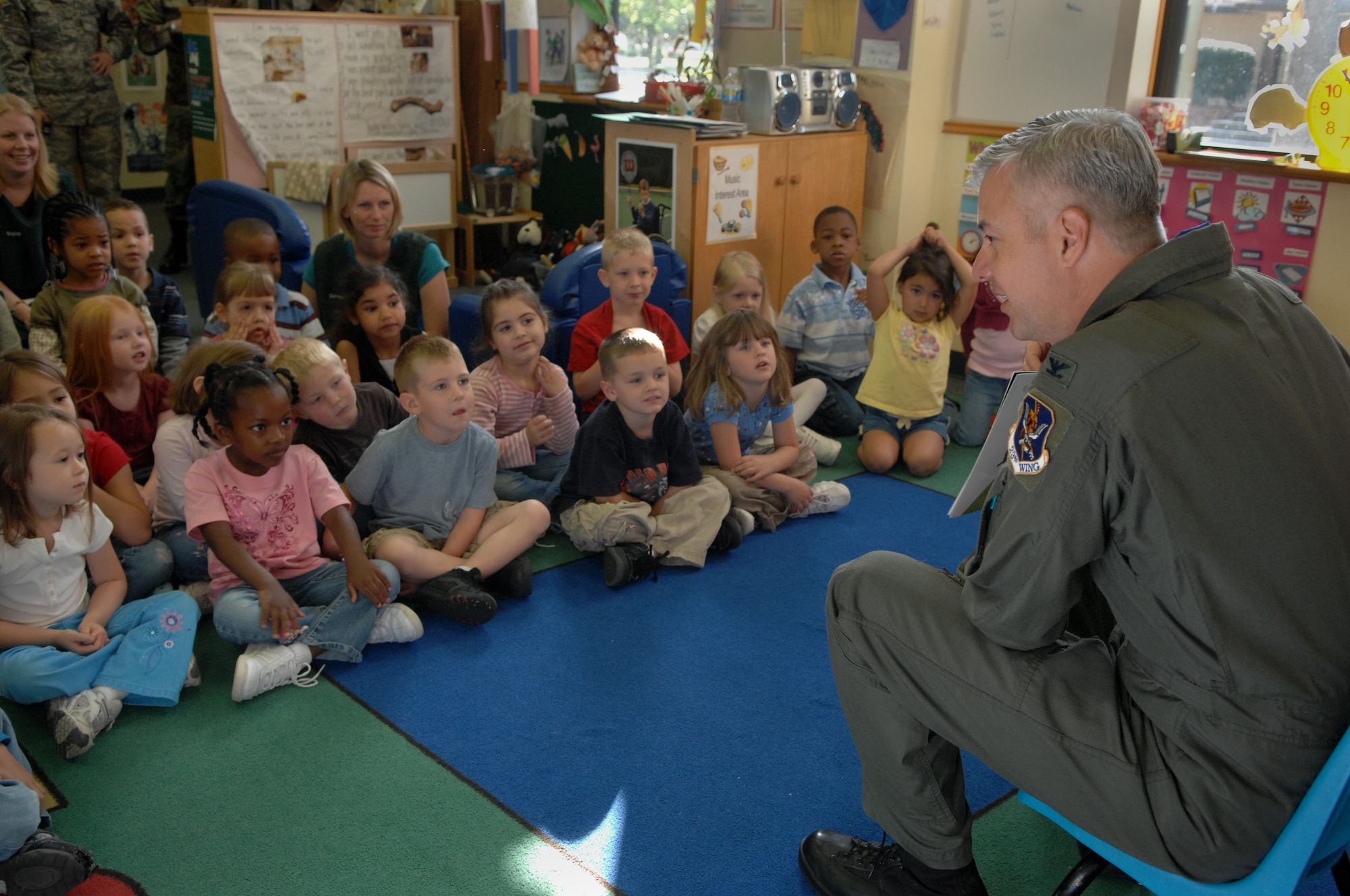 MOODY AIR FORCE BASE, Ga. -- Col. Kenneth Todorov, 23rd Wing commander, reads to children as part of the month of the military child at the Moody Child Development Center here April 14. April is designated as the Month of the Military Child to show the important role military children play in the armed forces community. (U.S. Air Force photo by Senior Airman Gina Chiaverotti)