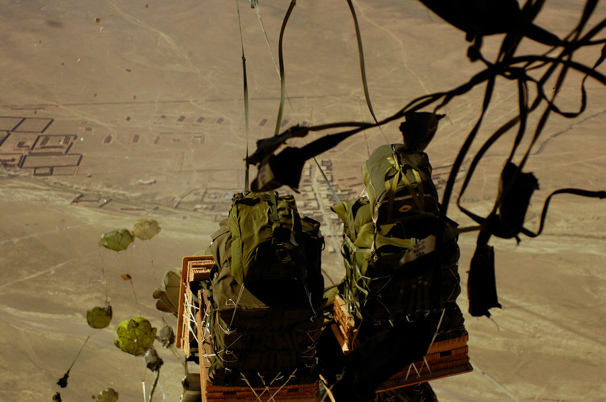 40 bundles of humanitarian supplies are dropped from a C-17 Globemaster III using the Joint Precision Airdrop Delivery System to a drop zone in Afghanistan, Apr., 13, 2008. (U.S. Air Force photo by Master Sgt. Andy Dunaway) The aircrew is from the 17th Airlift Squadron Charleston Air Force Base S.C., and is deployed to the 816th Expeditionary Airlift Squadron in Southwest Asia. (U.S. Air Force photo by Master Sgt. Andy Dunaway) (Released) (Released)
