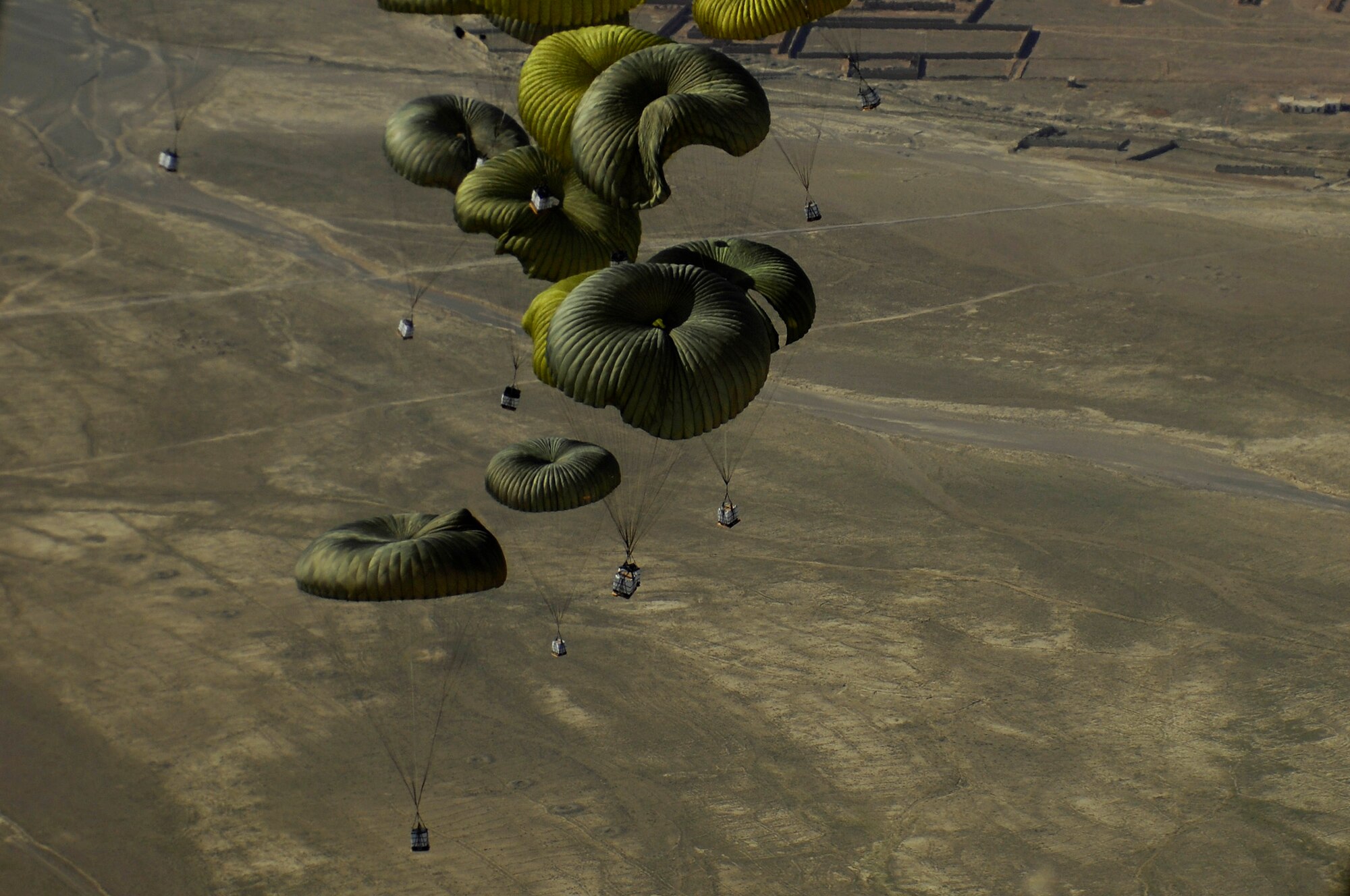 40 bundles of humanitarian supplies are dropped from a C-17 Globemaster III using the Joint Precision Airdrop Delivery System to a drop zone in Afghanistan, Apr., 13, 2008. (U.S. Air Force photo by Master Sgt. Andy Dunaway) The aircrew is from the 17th Airlift Squadron Charleston Air Force Base S.C., and is deployed to the 816th Expeditionary Airlift Squadron in Southwest Asia. (U.S. Air Force photo by Master Sgt. Andy Dunaway) (Released) (Released)
