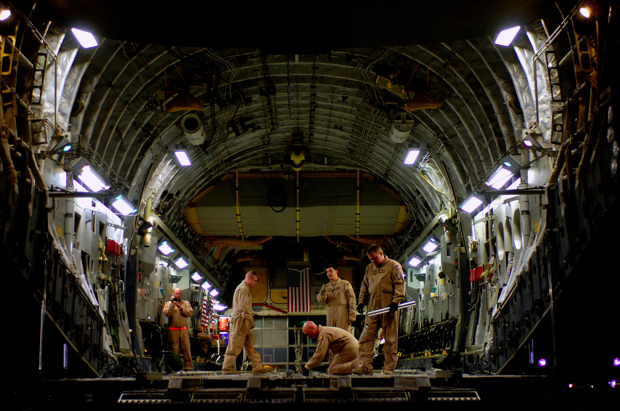 U.S. Air Force loadmasters preflight the C-17 Globemaster III for a Joint Precision Airdrop Delivery System of 40 bundles of humanitarian supplies to a drop zone in Afghanistan, Apr., 13, 2008. Loadmasters are from the 17th Airlift Squadron Charleston Air Force Base S.C., and are deployed to the 816th Expeditionary Airlift Squadron in Southwest Asia. (U.S. Air Force photo by Master Sgt. Andy Dunaway) (Released)
