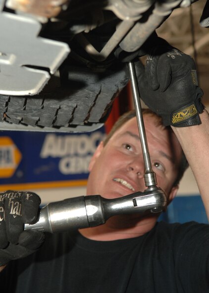 DYESS AIR FORCE BASE, Texas -- Mr. Pat Miner, from the Auto Skills Center takes apart the shell of a vehicle by unscrewing bolts in order to replace the parts of an engine, April 8. The Auto Skills Center is open to all servicemembers and their dependents.  