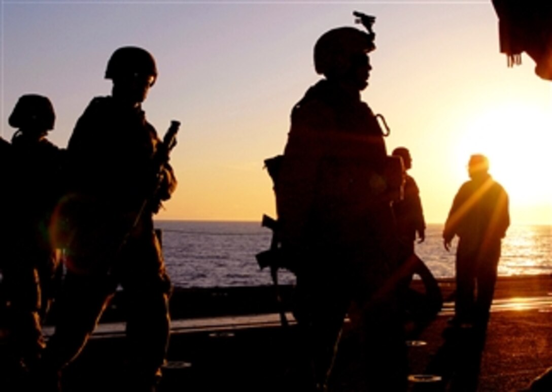 U.S. Marines perform fire drills to ensure combat readiness in the hangar bay aboard USS Peleliu, April 11, 2008, off the coast of Southern California. The Marines are assigned to the 15th Marine Expeditionary Unit Battalion Landing Team.