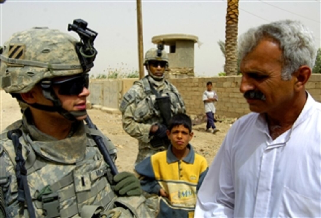 U.S. Army 1st Lt. Andrew Michael meets with a local sheik before a humanitarian aid mission in Mohammed al-Hindi Village, Wasit province, Iraq, April 8, 2008. Michael is a platoon leader assigned to 3rd Infantry Division's Alpha Company, 1st Battalion, 15th Infantry Regiment, 3rd Brigade Combat Team.