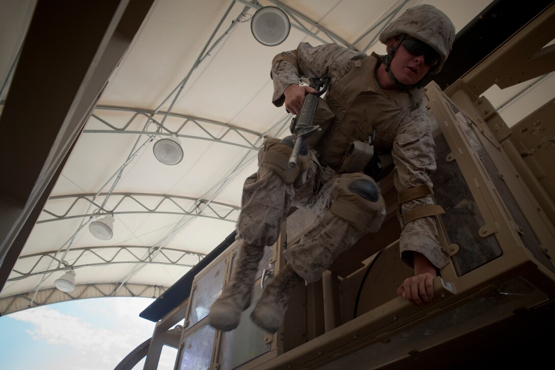 MARINE CORPS AIR GROUND COMBAT CENTER TWENTYNINE PALMS, Calif. - A Marine with Company C, 4th Combat Engineer Battalion, Lynchburg Va., leaps from a Mine Resistant Ambush Protected Vehicle Egress Trainer aboard Camp Wilson here July 4 during Exercise Javelin Thrust 2012. Javelin Thrust is an annual large-scale exercise which allows active and reserve Marines and Sailors from 38 different states to train together as a seamless Marine Air Ground Task Force. (Photo by Sgt. Alvin D. Parson/Released)