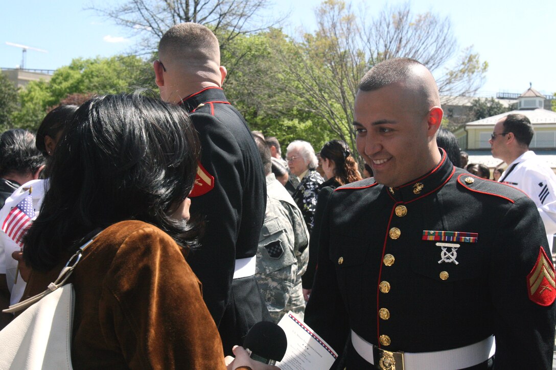 Cpl. Victor Alfonso Alejandretapia (right), personnel clerk, Headquarters and Service Company, Chemical Biological Incident Response Force, II Marine Expeditionary Force, talks about his experience in the Marine Corps and becoming a naturalized U.S. citizen with Luisa Fernanda Montero, an associate producer with the Hispanic Communications Network here April 14. Alejandretapia joined to Marine Corps in 2004 as a Mexican citizen.  (Official U.S. Marine Corps photo by Cpl. Leslie Palmer) (RELEASED)