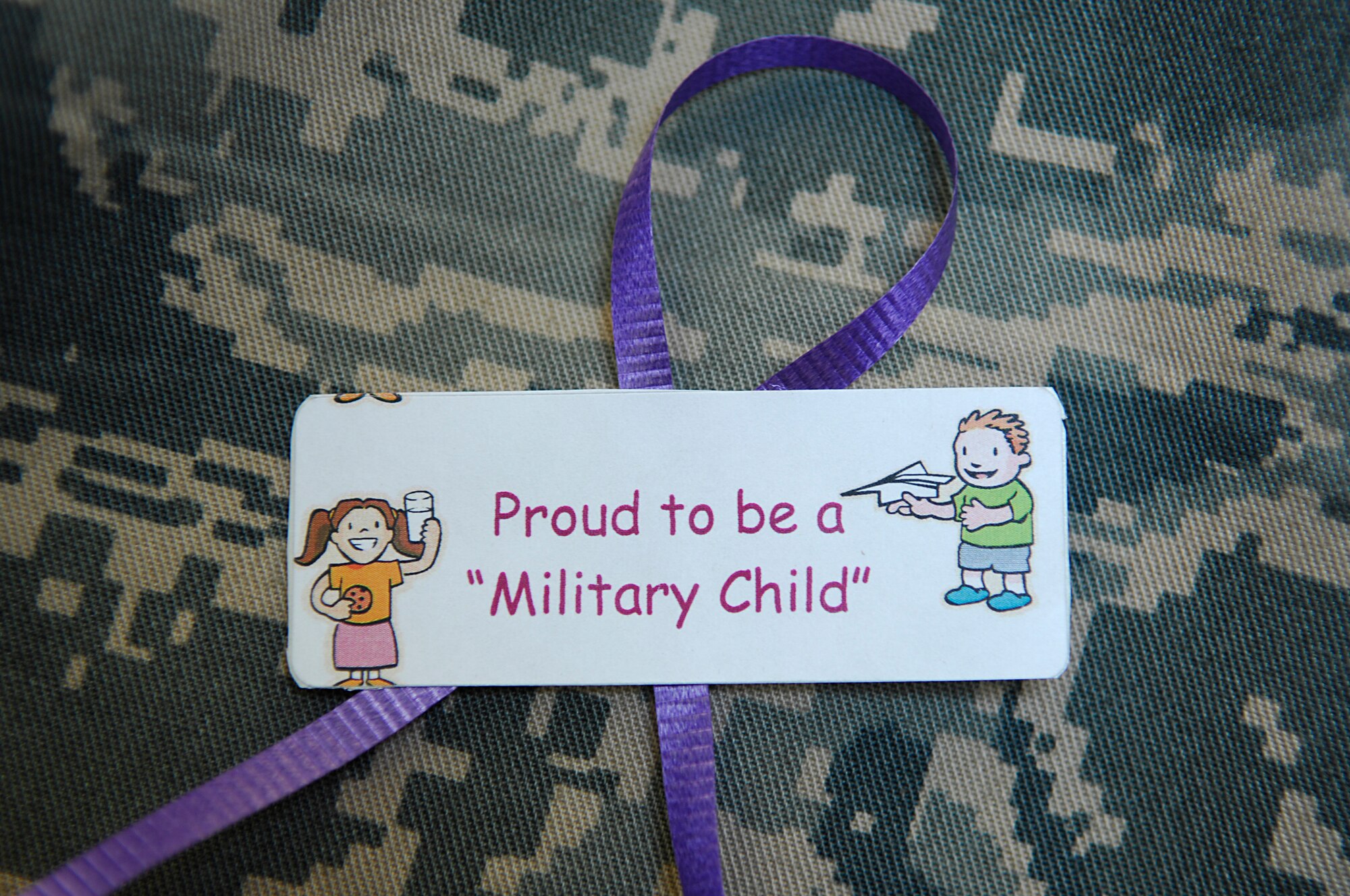 MINOT AIR FORCE BASE, N.D. -- Military personnel here are authorized to wear purple ribbons on their uniforms from April 21 to 25 in support of the Month of the Military Child. People can show their support by tying a purple ribbon to items like their uniform, car, etc. (U.S. Air Force photo by Staff Sgt. Thomas Dow)