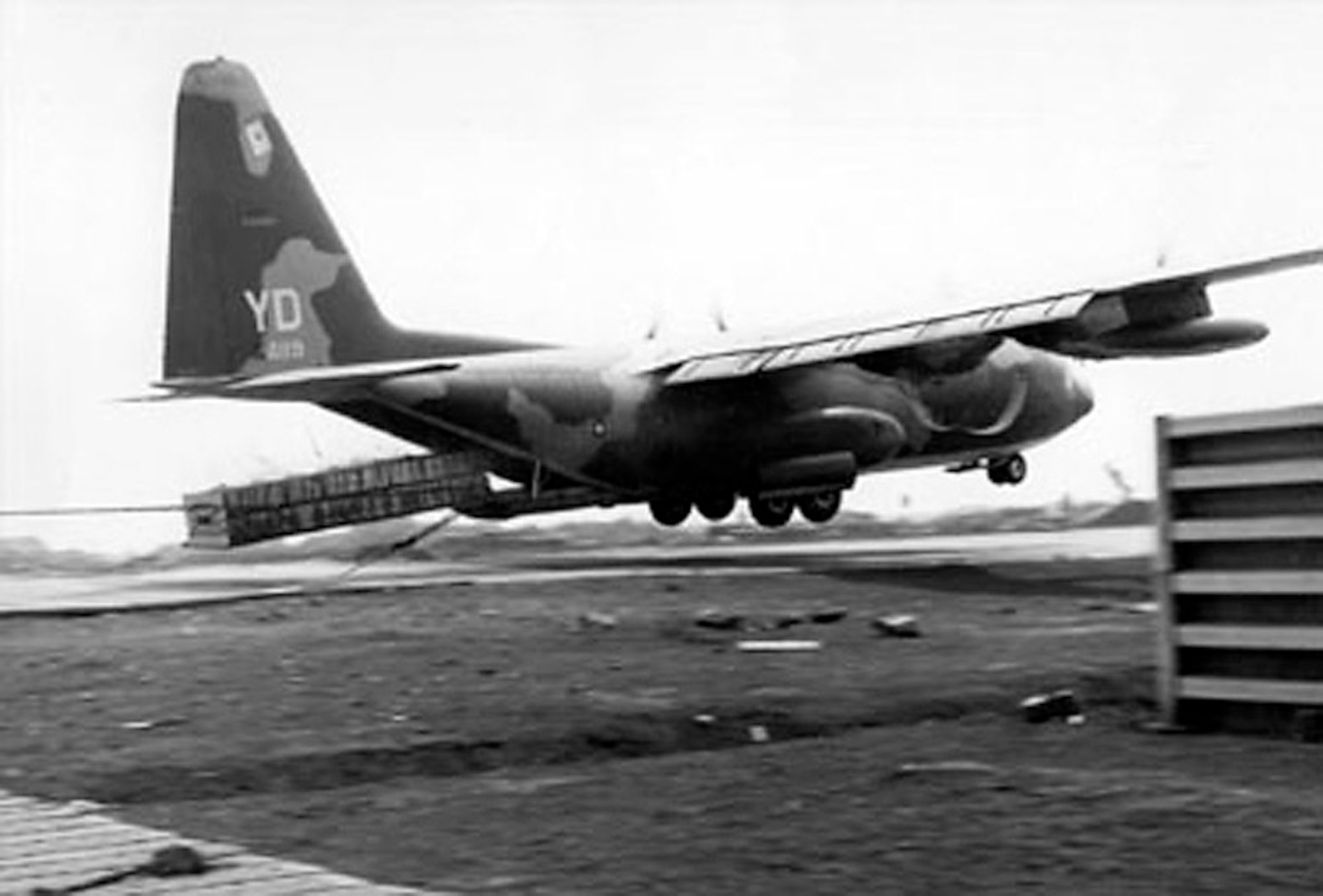 In Vietnam in 1968, C-130 Hercules aircraft resupplied the besieged Marine garrison at Khe Sanh. Exposed to enemy fire, C-130s often flew in low to drop pallets of desperately needed supplies, as seen here. (Courtesy photo)
