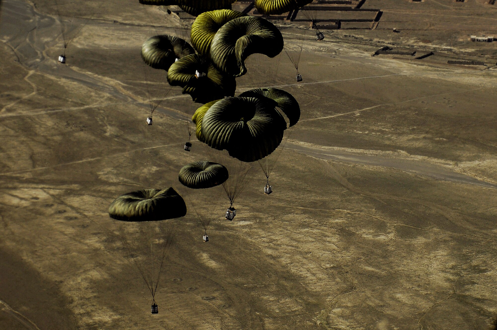 Forty bundles of humanitarian supplies are dropped from a C-17 Globemaster III using the Joint Precision Airdrop Delivery System to a drop zone April 13 in Afghanistan. The C-17 aircrew is from the 17th Airlift Squadron from Charleston Air Force Base, S.C. (U.S. Air Force photo/Master Sgt. Andy Dunaway)