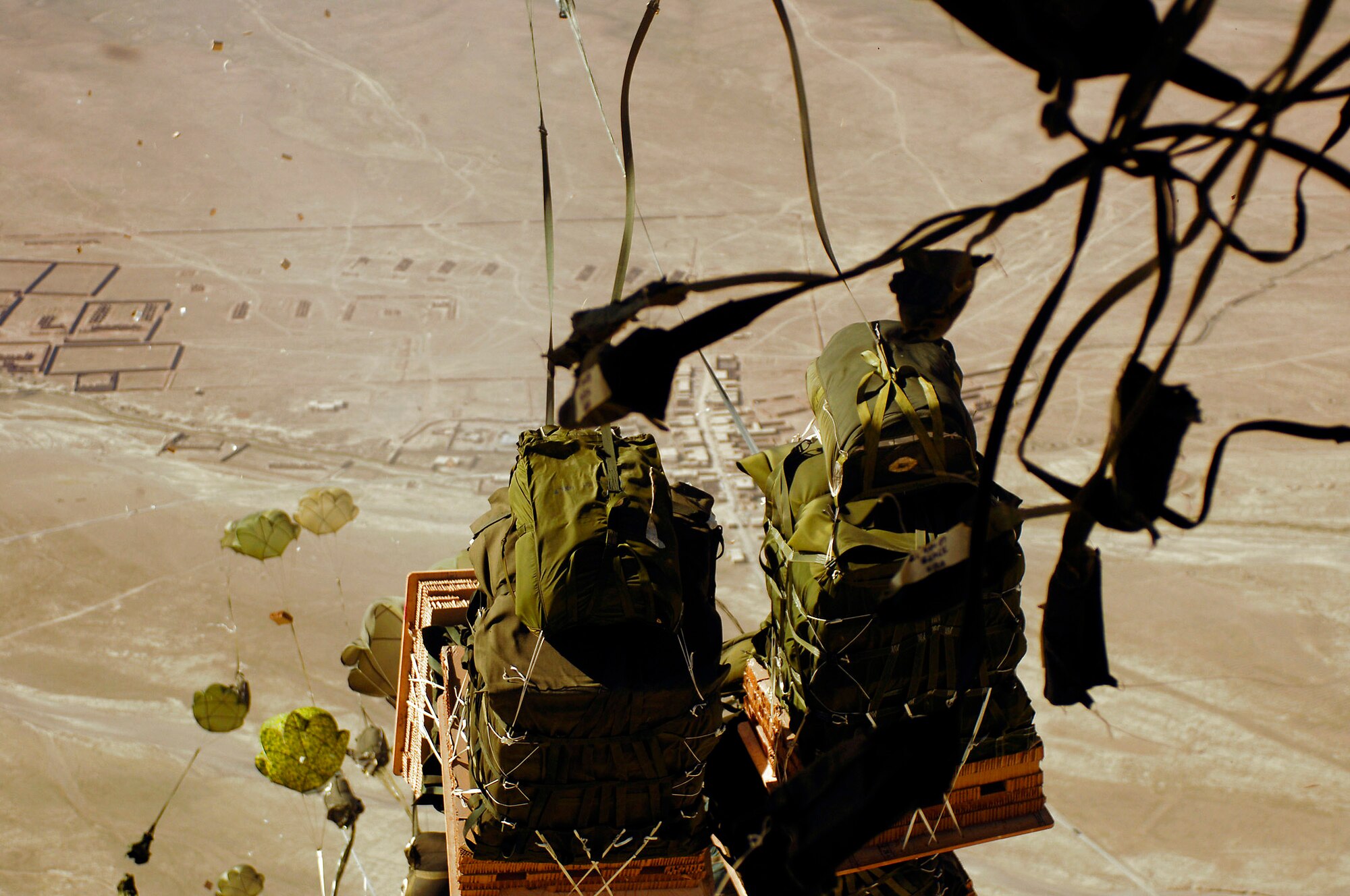 Forty bundles of humanitarian supplies are dropped from a C-17 Globemaster III using the Joint Precision Airdrop Delivery System to a drop zone April 13 in Afghanistan. The C-17 aircrew is from the 17th Airlift Squadron from Charleston Air Force Base, S.C. (U.S. Air Force photo/Master Sgt. Andy Dunaway)