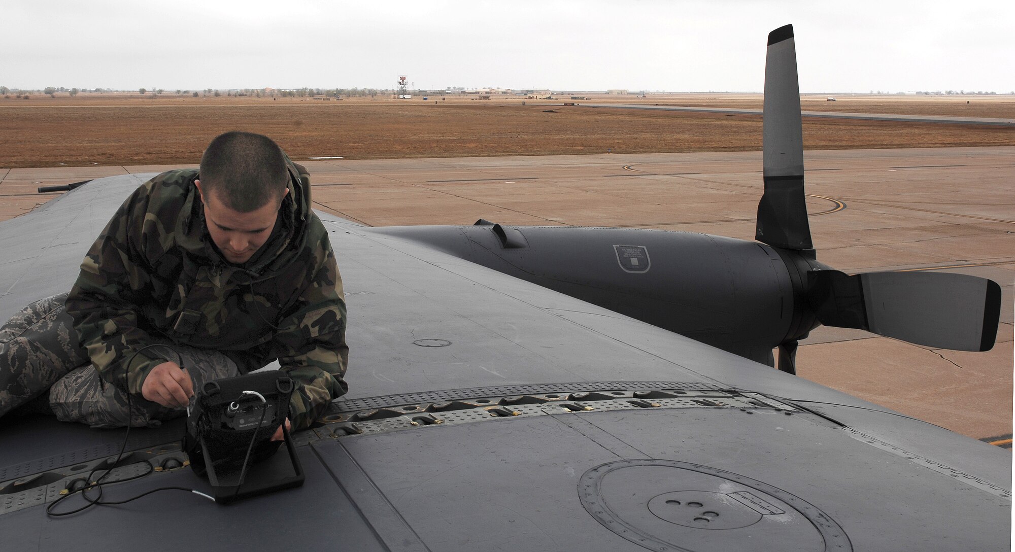 CANNON AIR FORCE BASE N.M.-- Senior Airman Raynard Betancourt, 27th Special Operations Equipment Maintenance Squadron, inspects a C-130 aircraft on April 9. The Maintenance Professional of the Year banquet on April 26 salutes the best maintainers of the 27th Special Operations Wing.  (U.S. Air Force photo by Airman 1st Class Liliana Moreno)