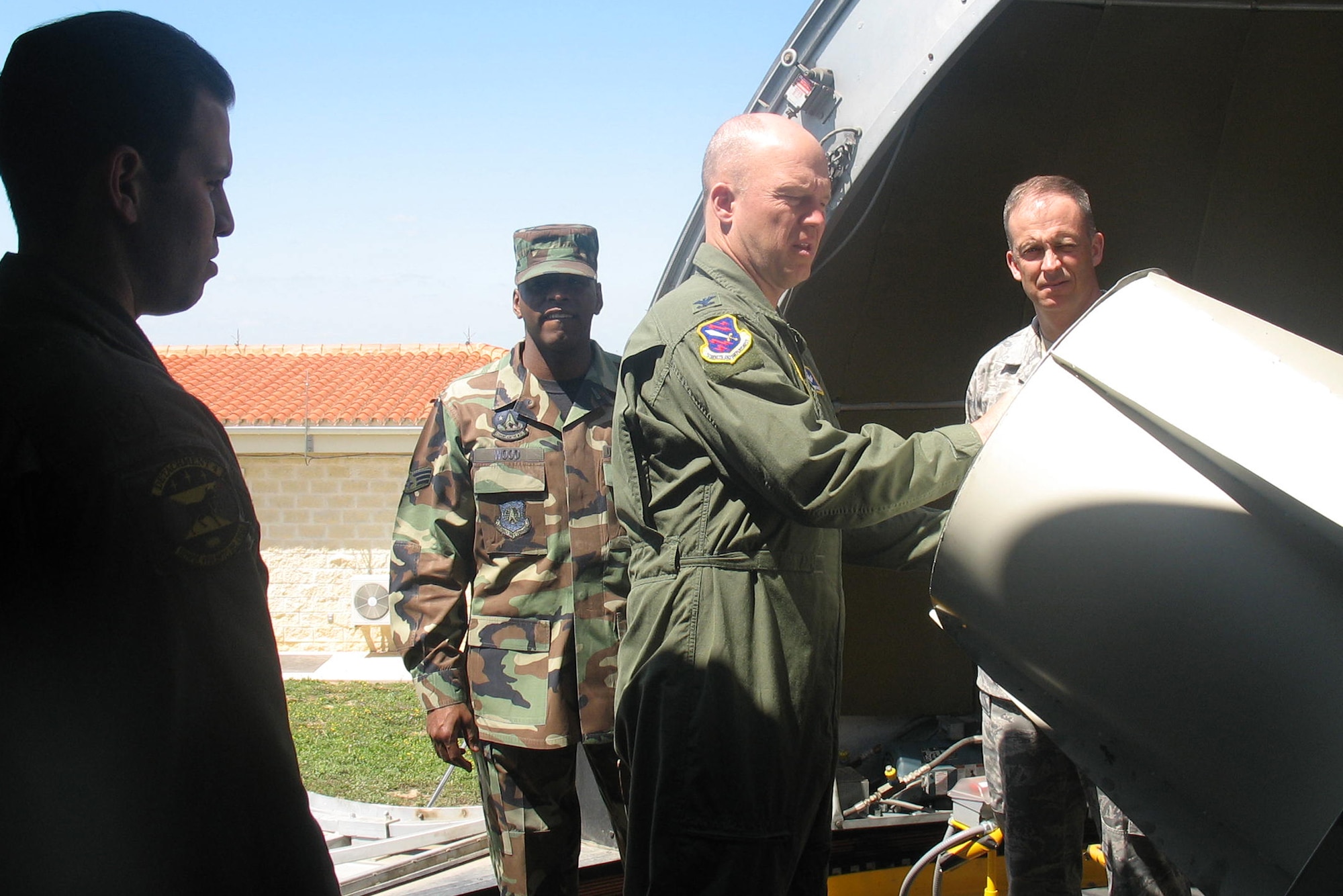 Col. Jay Raymond, 21st Space Wing commander, and Chief Master Sgt. Timothy Omdal, 21st SW command chief, look on at Moron Optical Space Surveillance System telescope as Maj. Roberto Colon (left) briefs them on the system’s capabilities April 12. Colonel Raymond and Chief Omdal visited the detachment, based at Moron Air Base, Spain, to get a first-hand look at how the unit contributes to U.S. Strategic Command’s space control mission of detecting, tracking and identifying all manmade deep-space objects. (U.S. Air Force photo/Senior Airman Karen Ness)