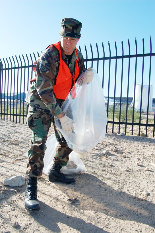 Staff Sgt. David Nichols, aircraft maintainer and Junior Enlisted Council member, helps pick up trash in front of the base as part of the council’s ‘Adopt Valencia’ monthly cleanup effort. The JEC takes on several projects each year to improve the base and the local community. (Air National Guard photo by Capt. Gabe Johnson)