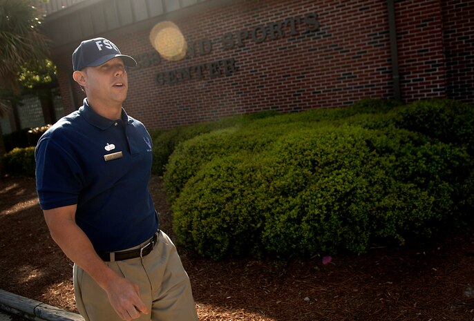 Tech. Sgt. Shawn McKeen walks from the cardio room to the front office of the 437th Force Support Squadron Fitness and Sports Center on Charleston AFB Tuesday. The 437th Mission Support and Services Squadrons merged April 10 to make one team as part of an Air Force initiative. Sergeant McKeen is the NCO in charge of the 437 FSS' Fitness and Sports Center. (U.S. Air Force photo/Senior Airman Nicholas Pilch) 