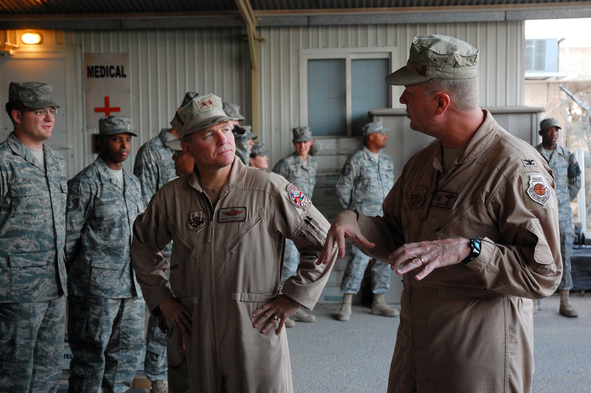 SOUTHWEST ASIA -- Colonel Robert Swisher (right), Commander of the 386th Air Expeditionary Wing, talks with Maj. Gen. Maurice H. Forsyth, current Deputy Combined Forces Air Component Commander, U.S. Central Command, April 14, 2008, during a visit with Airmen assigned to the 387th Air Expeditionary Group at an air base in the Persian Gulf Region. General Forsyth and Maj. Gen. Douglas Raaberg are visiting Airmen throughout the area of responsibility as part of an orientation trip and to get a first-hand look at Airmen accomplishing a variety of different mission sets supporting the Global War on Terrorism. (U.S. Air Force photo/ Staff Sgt. Patrick Dixon)  