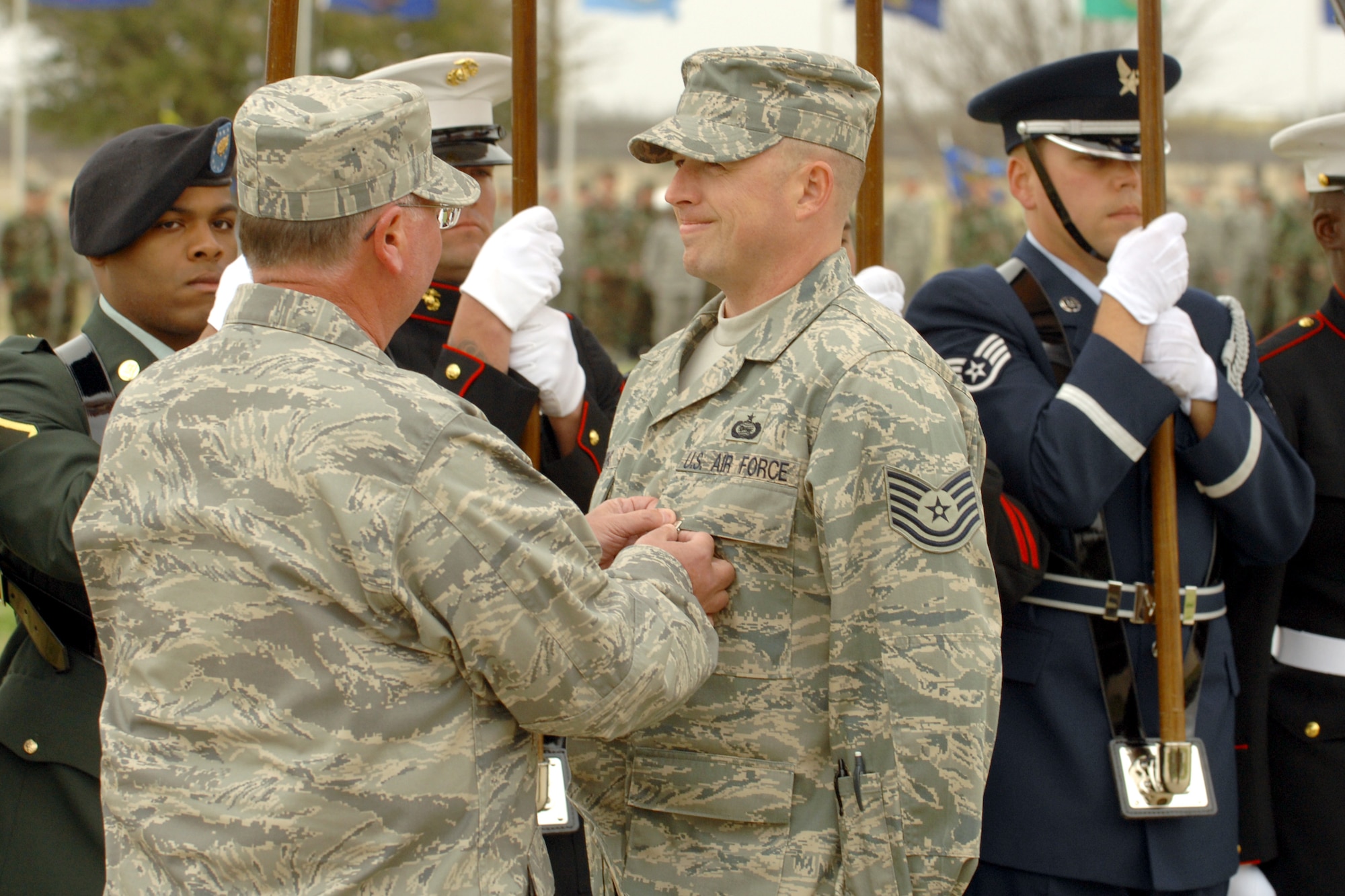 Colonel Richard Ayres, 17th Training Wing commander, pins the Bronze Star on Tech. Sgt. Christopher Lyons at the Pass in Review ceremony March 28. (U.S. Air Force photo by Staff Sgt. John Barton)