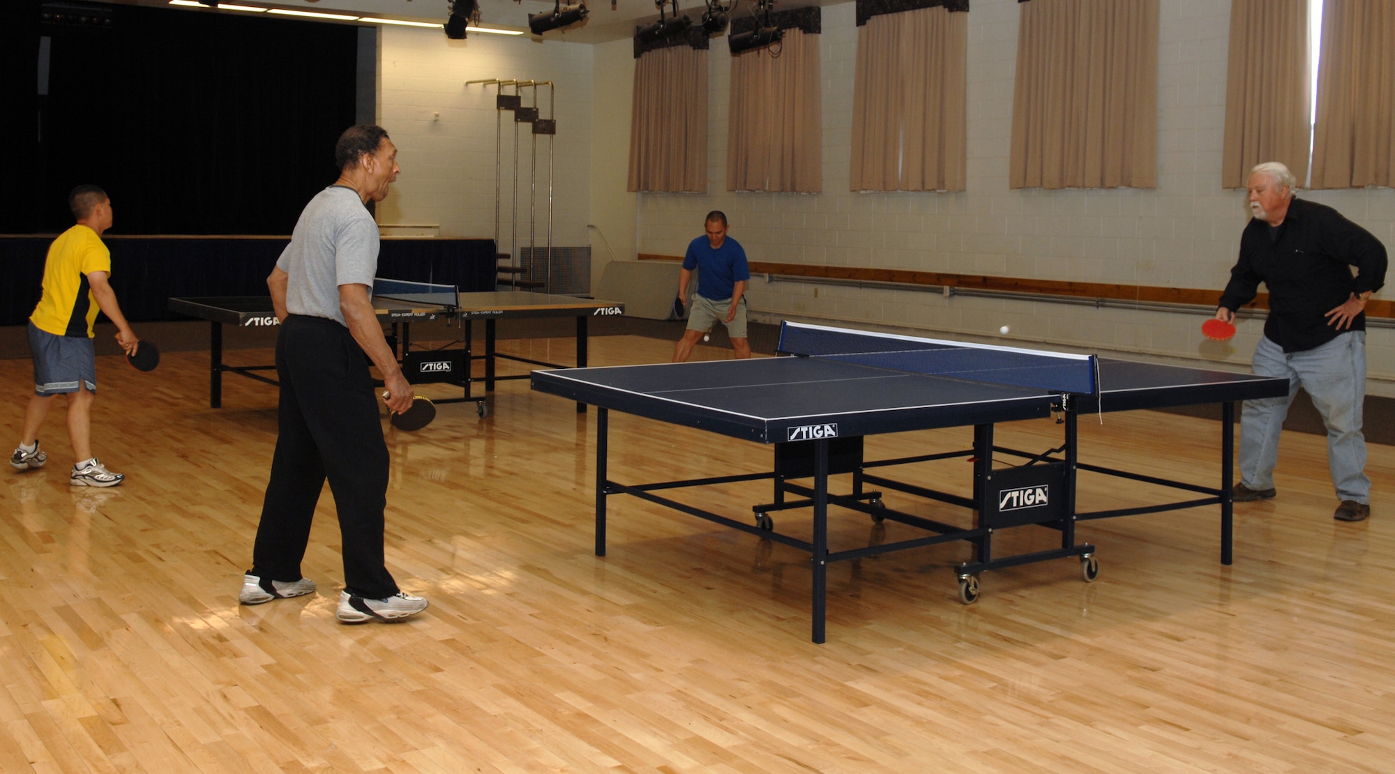 HOLLOMAN AIR FORCE BASE, N.M. ? Airmen and military retirees compete in a ping pong tournament April 11 at the Community Center here. Along with ping pong tournaments, the Community Center also holds gaming tournaments, using Xbox?s and Playstations. (U.S. Air Force photo by Airman Sondra M. Wieseler)