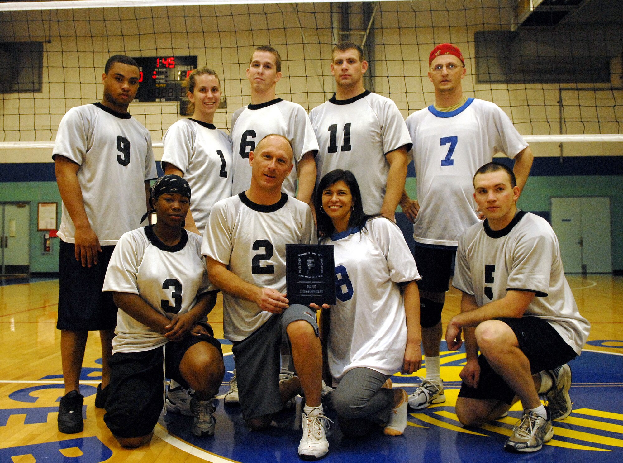 The 17th Mission Support Group Junk Yard Dogs pose for a team photo after winning the 2008 Base Volleyball Championship game April 2. (U.S. Air Force photo by Senior Airman Kamaile Chan)