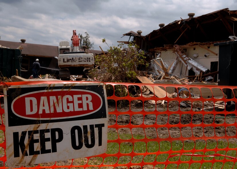 MOODY AIR FORCE BASE, Ga. -- Contractors work in a hard-hat area to demolish the old legal office building here April 14. The legal office along with many other agencies on base have been relocated to the Parker Greene Base Support Center. (U.S. Air Force photo by Airman 1st Class Brittany Barker)