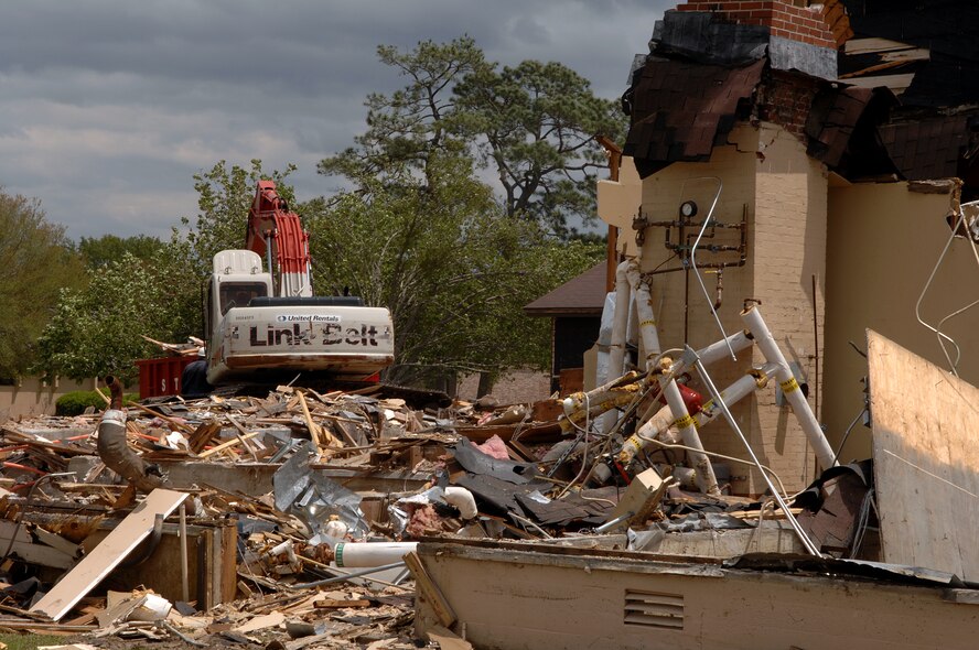 MOODY AIR FORCE BASE, Ga. -- Contractors tear down a building where the legal office used to be located here April 14. The legal office has been moved to the Parker Greene Base Support Center. (U.S. Air Force photo by Airman 1st Class Brittany Barker)