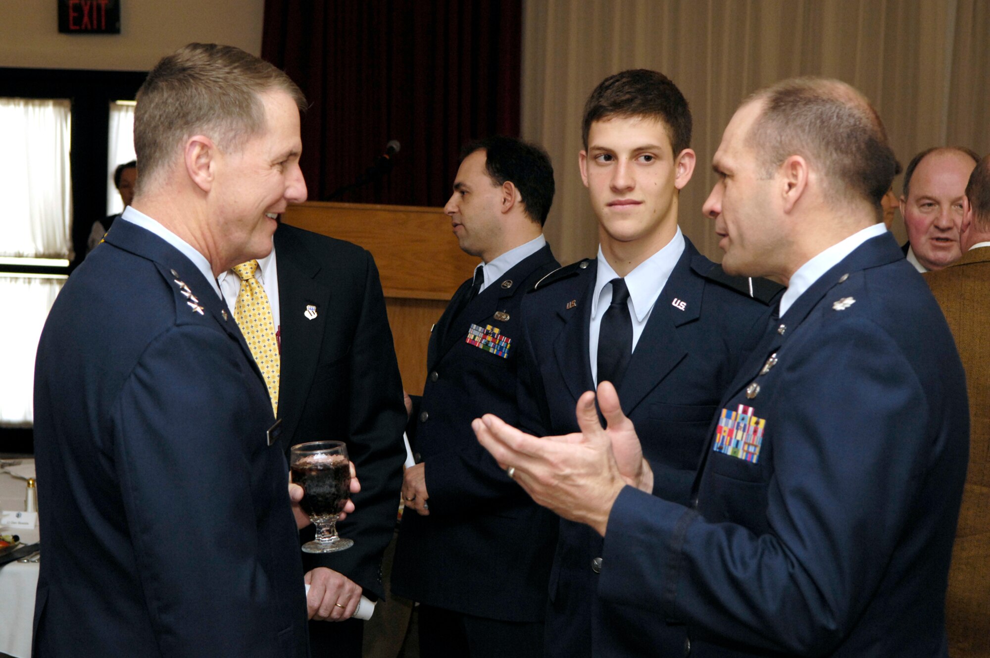 HANSCOM AFB, Mass. -- Electronic Systems Center Commander Lt. Gen. Ted Bowlds chats with Air Force ROTC cadet Benjamin Katz, a student at Northeastern University, and Lt. Col. Shane Johnson, professor of Aerospace Studies at Boston University, prior to the Old Crows scholarship luncheon April 11 at the Minuteman Club.  The Patriots’ Roost Chapter of the Association of Old Crows presented 21 ROTC students with $1,000 scholarships. ( U.S. Air Force photo by Mark Wyatt)
