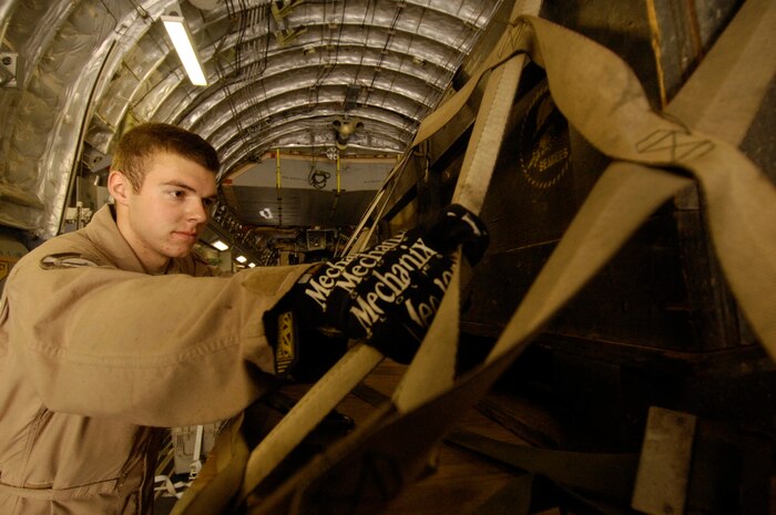 Airman 1st Class Joshua Weston secures a pallet of humanitarian supplies on a Charleston C-17 Globemaster III to be transported, along with 20 Navy Seabees, to Nairobi, Kenya, from Camp Lemonier, Djibouti, recently. Airmen deployed from Charleston AFB assisted Kenyans with vital supplies as part of Joint Task Force-Horn of Africa. Airman Weston is a 17th Airlift Squadron loadmaster and is deployed with the 816th Expeditionary Airlift Squadron. (U.S. Air Force photo/Staff Sgt. Christina Styer)