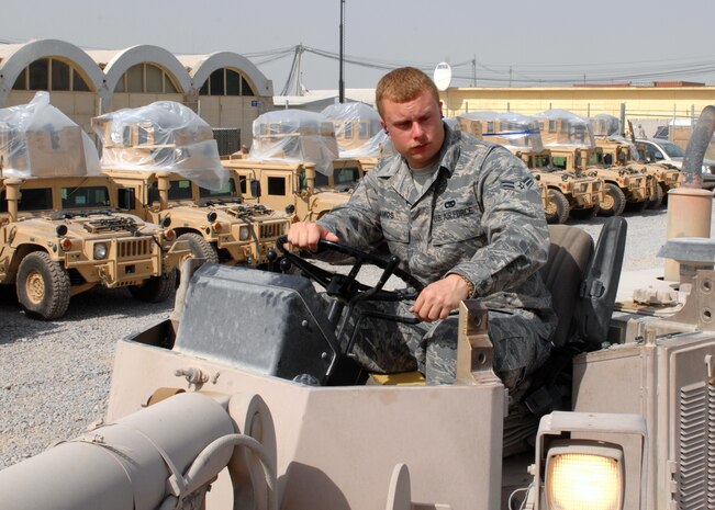 KANDAHAR AIR FIELD, Afghanistan - Airman 1st Class Ryan Amos, 451st Air Expeditionary Group Air Transportation Journeyman, drives a 10k all- terrain forklift in the ATOC outbound yard. Airman Amos, who is deployed from 437th Aerial Port Squadron, Charleston South Carolina, was recently selected as the Warrior of the Week for his outstanding work. (U.S. Air Force photo by Master Sgt. Demetrius Lester)