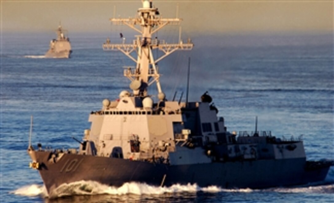 The guided-missile destroyer USS Gridley and the guided-missile frigate USS Thach follows behind the Nimitz-class aircraft carrier USS Ronald Reagan, April 13, 2008, while under way in the Pacific Ocean during a joint exercise in preparation for deployment.