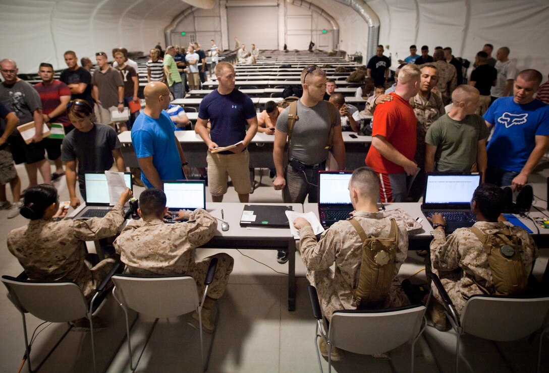 Reserve Marines and Sailors check into exercise Javelin Thrust at the Joint Reception Center of Camp Wilson July 5, 2012. Javelin Thrust is an annual large-scale exercise here which allows active and reserve Marines and sailors from 38 different states to train together as a seamless Marine Air Ground Task Force.
