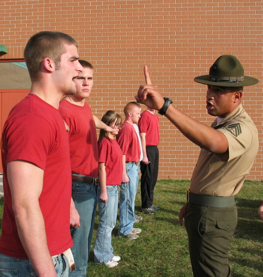 Drill Instructor Staff Sgt. Damian Rodriguez teaches a poolee how to count off during a family night event April 16. More than 100 poolees from Recruiting Substations Kalamazoo and Battle Creek, along with friends and families, attended the event. Three drill instructors talked to the parents and poolees about the transformation their sons or daughters would go through during their 13 weeks in recruit training. Rodriguez is assigned to 1st Recruit Training Battalion, Delta Company, Marine Corps Recruit Depot San Diego.