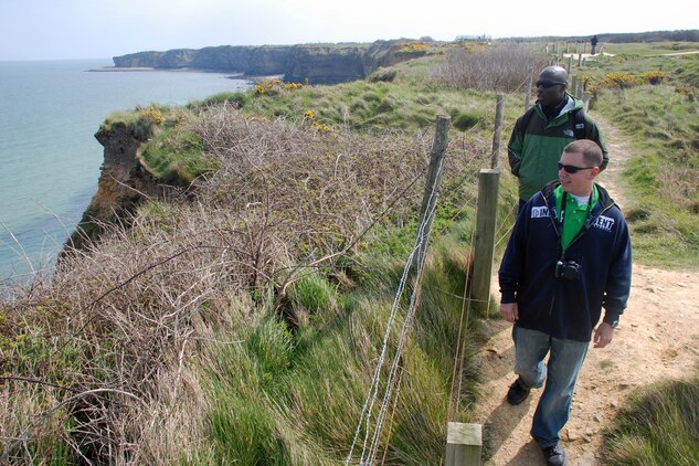 Sergeants Justin Pauley, front right, and Jude Castro walk the cliffs of Pointe du Hoc during a battlefield study trip to Normandy, France. Pointe du Hoc was the sight of a  significant battle during the early hours of the invasion of Nazi occupied Europe.