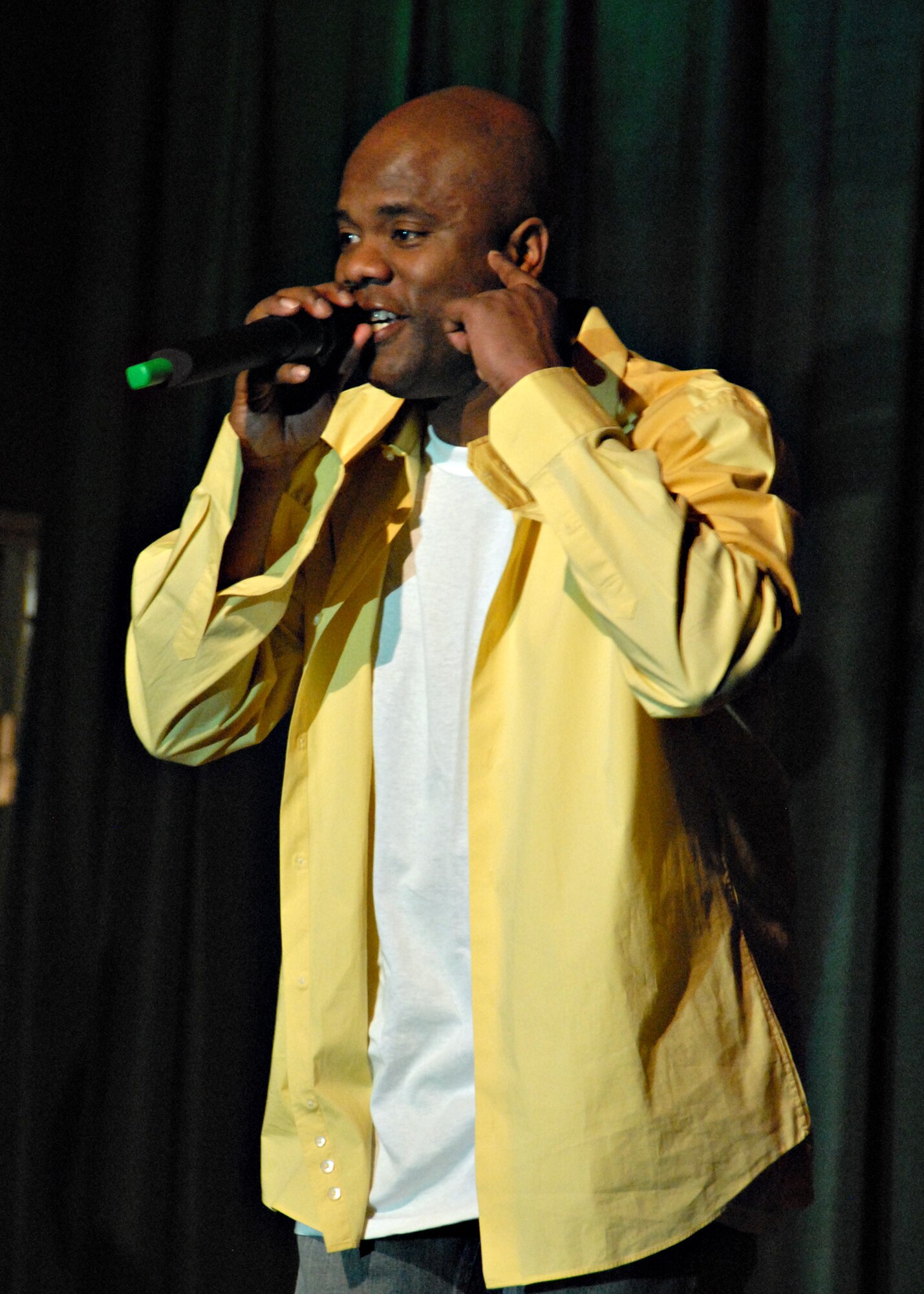 MISAWA AIR BASE, Japan -- Master Sgt. Gary Wimbush, 35th Communications Squadron, performs "She's All I Got" by Jimmy Cozier during Misawa Idol here on April 5, 2008. Despite forgetting the lyrics, Sergeant Wimbush was able to improvise and advanced to the next round. (U.S. Air Force photo by Staff Sgt. Rachel Martinez)
