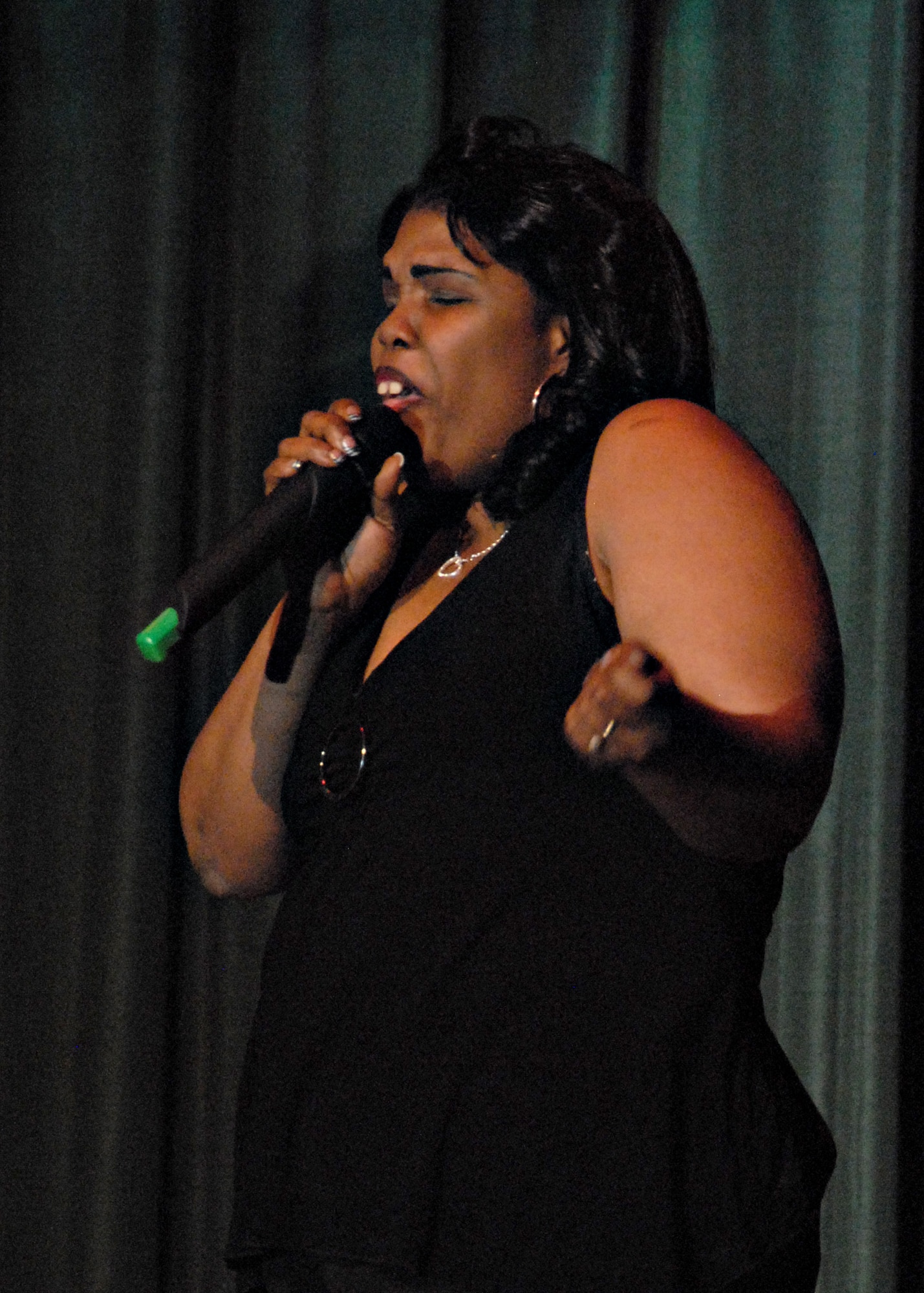 MISAWA AIR BASE, Japan -- Lanita Roney sings "Giving Him Something He Can Feel" by EnVogue during the first round of Misawa Idol April 5, 2008. Soliciting a huge crowd reaction, Ms. Roney advanced to the next round. (U.S. Air Force photo by Staff Sgt. Rachel Martinez)