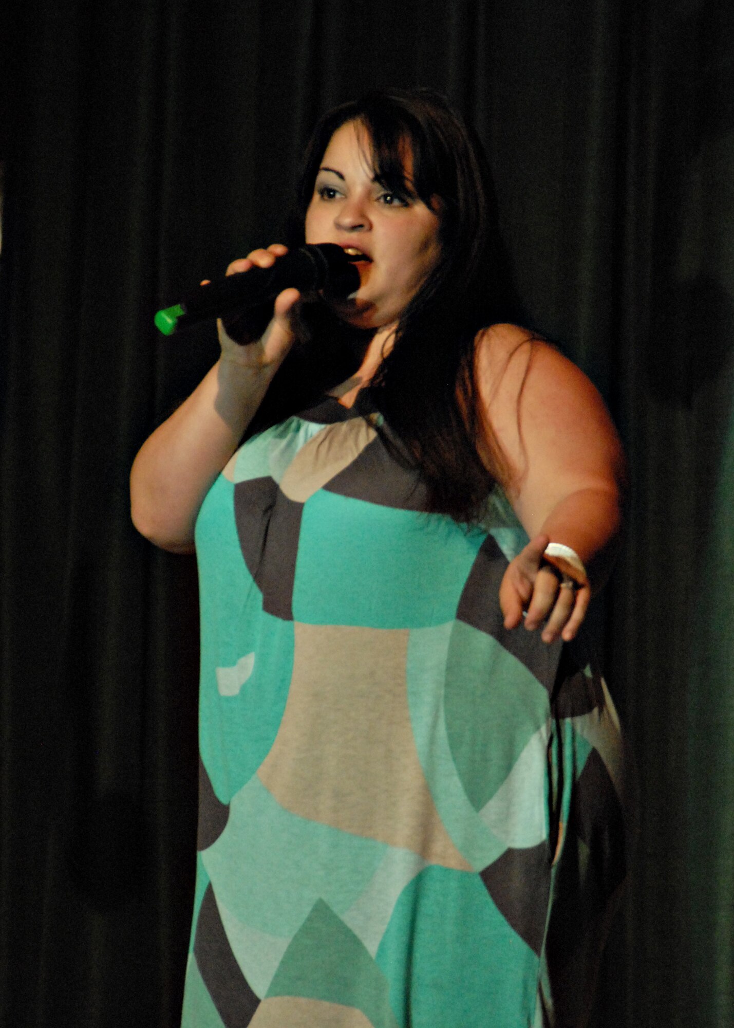 MISAWA AIR BASE, Japan -- Cynthia Fontes-Davis performs "Black Velvet" by Alannah Myles during Misawa Idol April 5, 2008. The judges commended her for overcoming the stage fright she had during auditions. (U.S. Air Force photo by Staff Sgt. Rachel Martinez)