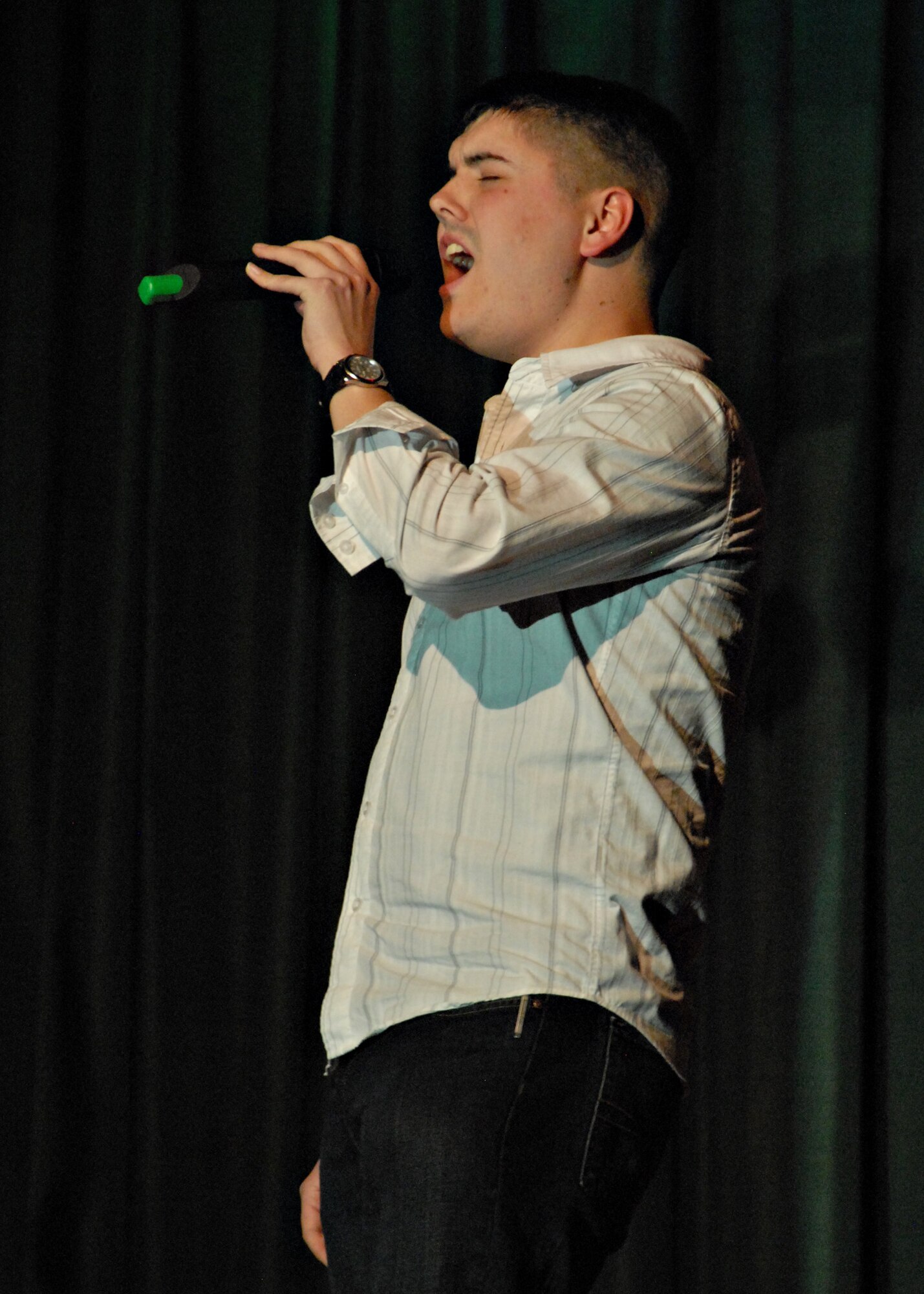 MISAWA AIR BASE, Japan -- Senior Airman Samuel Morse, 35th Fighter Wing, sings "Minnie The Moocher" by Cab Calloway during the first round of Misawa Idol here April 5, 2008. Airman Morse got the audience involved in singing and advanced to the second round on April 19. (U.S. Air Force photo by Tech. Sgt. Russell McBride)