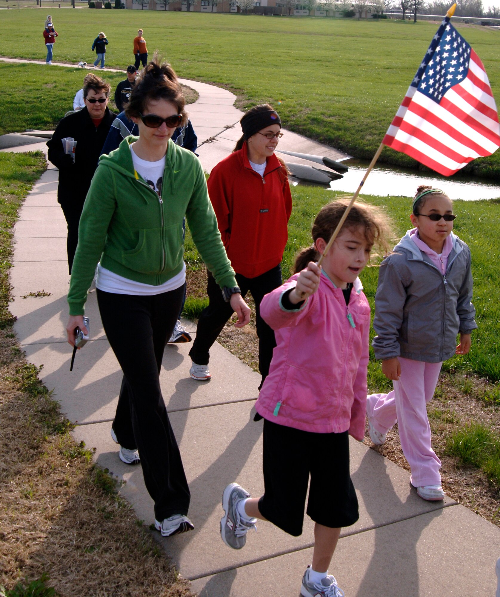 MCCONNELL AIR FORCE BASE, Kan. -- The McConnell Child Development Center hosted a family walk April 12 in honor of the Month of the Military Child. The walk gave Team McConnell members a chance to spend time with their families.  The 22nd Services Squadron is scheduled to host Family Festival of Fun April 19, Beat the Pro's Golf Tournament April 19, and Toddle Time & Preschool Story Time April 21.  (Photo by Staff Sgt. Ronald Lafosse)