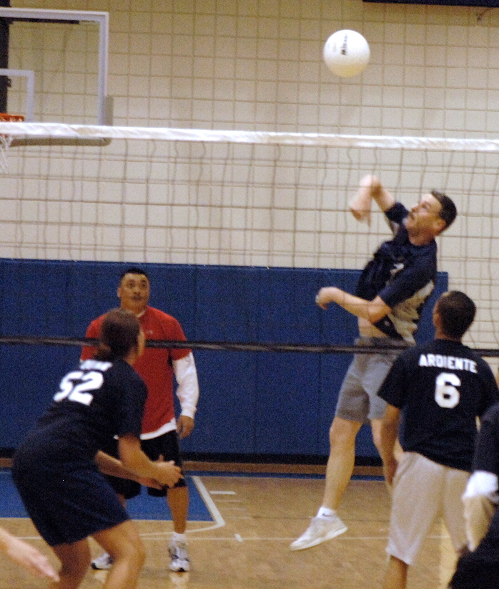 MCCONNELL AIR FORCE BASE, Kan. -- Master Sgt. Christopher Slifko, 22nd Logistics Readiness Squadron, annihilates the 22nd Services Squadron team with a spike to the middle of the court at the Fitness Center here, April 15.  The 22nd LRS shut out the 22nd SVS team 25-18, 25-11, bringing their record to five wins and zero losses this season.  (Photo by Staff Sgt. Ronald Lafosse.)
