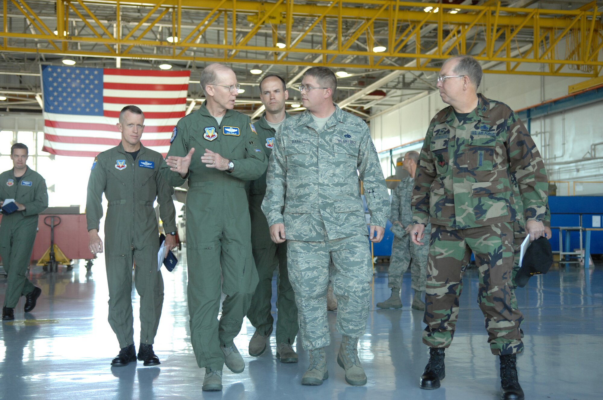 General John Corley (front left), Air Combat Command commander, speaks with Staff Sgt. Zachary Barry (center), 355th Equipment Maintenance Squadron, during his visit to Davis-Monthan April 15. (U.S. Air Force photo by Airman 1st Class Noah R. Johnson)