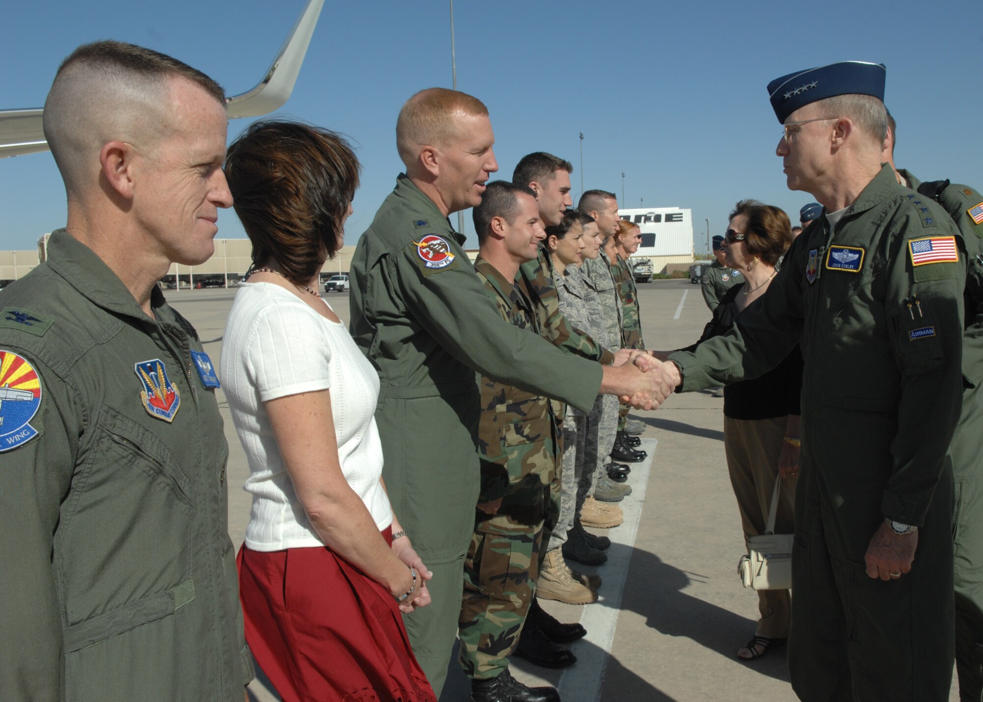 Gen. John Corley, Air Combat Command commander, coins a group of Airmen from D-M April 16 for their hard work and contributions in making his tour of the base a success.  General Corley and his wife, Mrs. Alice Corley, spent four days here visiting many areas of the base and speaking with Airmen.  (U.S. Air Force photo by Senior Airman Alesia Goosic