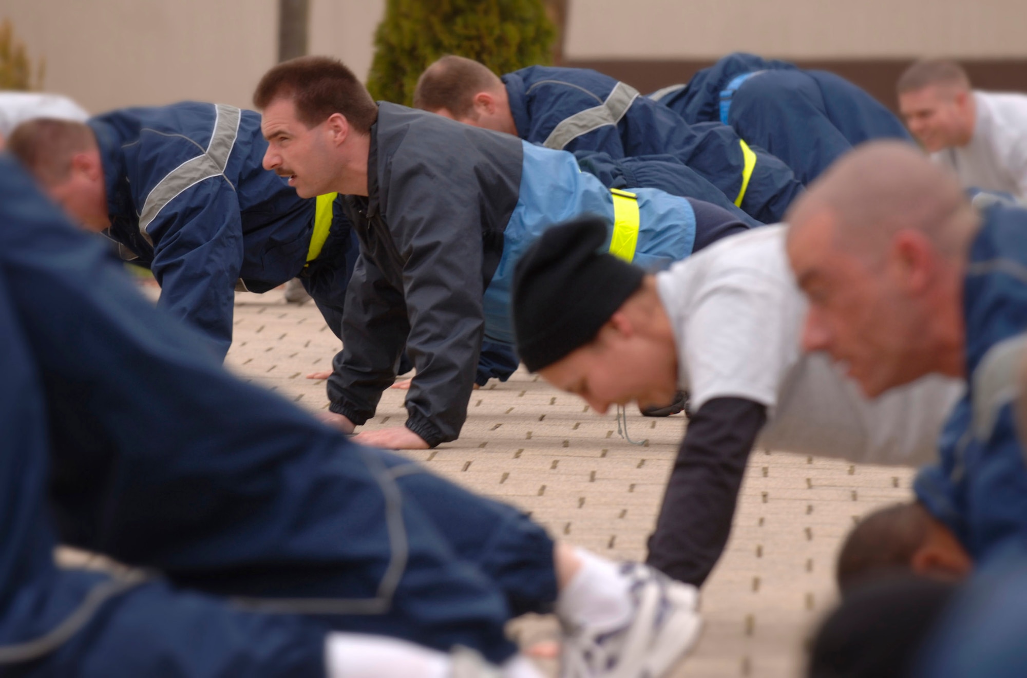 German air force Master Sgt. Holger Fels joins fellow Kisling Noncommissioned Officer Academy students during a daily physical training session April 26 at Kapaun Air Station, Germany. Sergeant Fels, a German NCO Aaademy instructor in Appen, Germany, voluntarily enrolled in the six-week academy course designed for U.S. Air Force technical sergeants to prepare for a four-year special duty assignment as an exchange instructor at the Senior NCO Academy at Maxwell Air Force Base, Ala. (U.S. Air Force photo/Master Sgt. Scott Wagers) 
