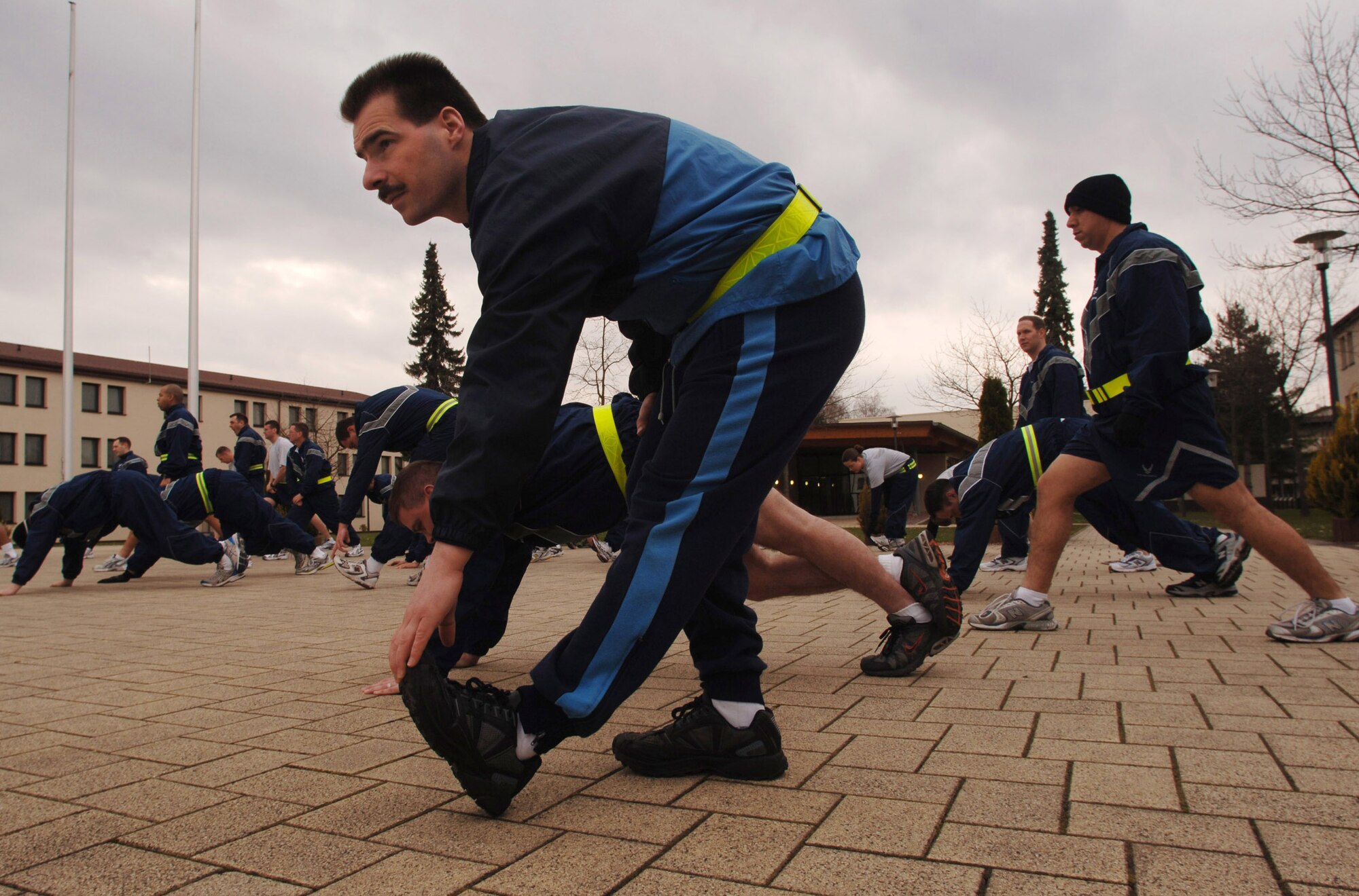 German air force Master Sgt. Holger Fels joins fellow Kisling Noncommissioned Officer Academy students during a daily physical training session April 26 at Kapaun Air Station, Germany. Sergeant Fels, a German NCO Aaademy instructor in Appen, Germany, voluntarily enrolled in the six-week academy course designed for U.S. Air Force technical sergeants to prepare for a four-year special duty assignment as an exchange instructor at the Senior NCO Academy at Maxwell Air Force Base, Ala. (U.S. Air Force photo/Master Sgt. Scott Wagers) 
