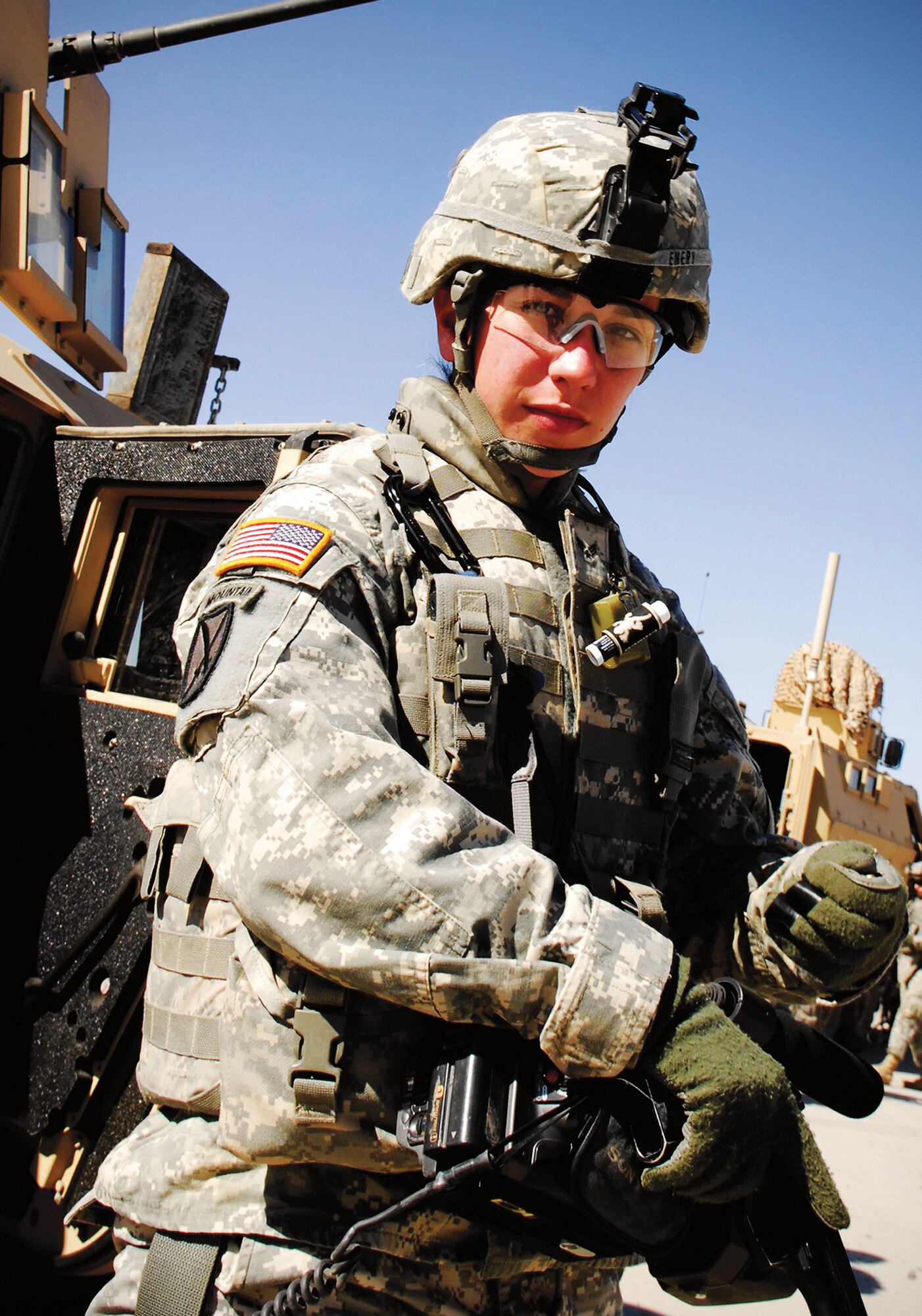U.S.  Air Force Senior Airman Michelle Emery, Combat Camera, attached to U.S.  Army's 10th Mountain Division clears her M-9 Beretta, after completing a mission, Kirkuk, Iraq. 
(U.S. Air Force Photo by Staff Sgt. Samuel Bendet)
