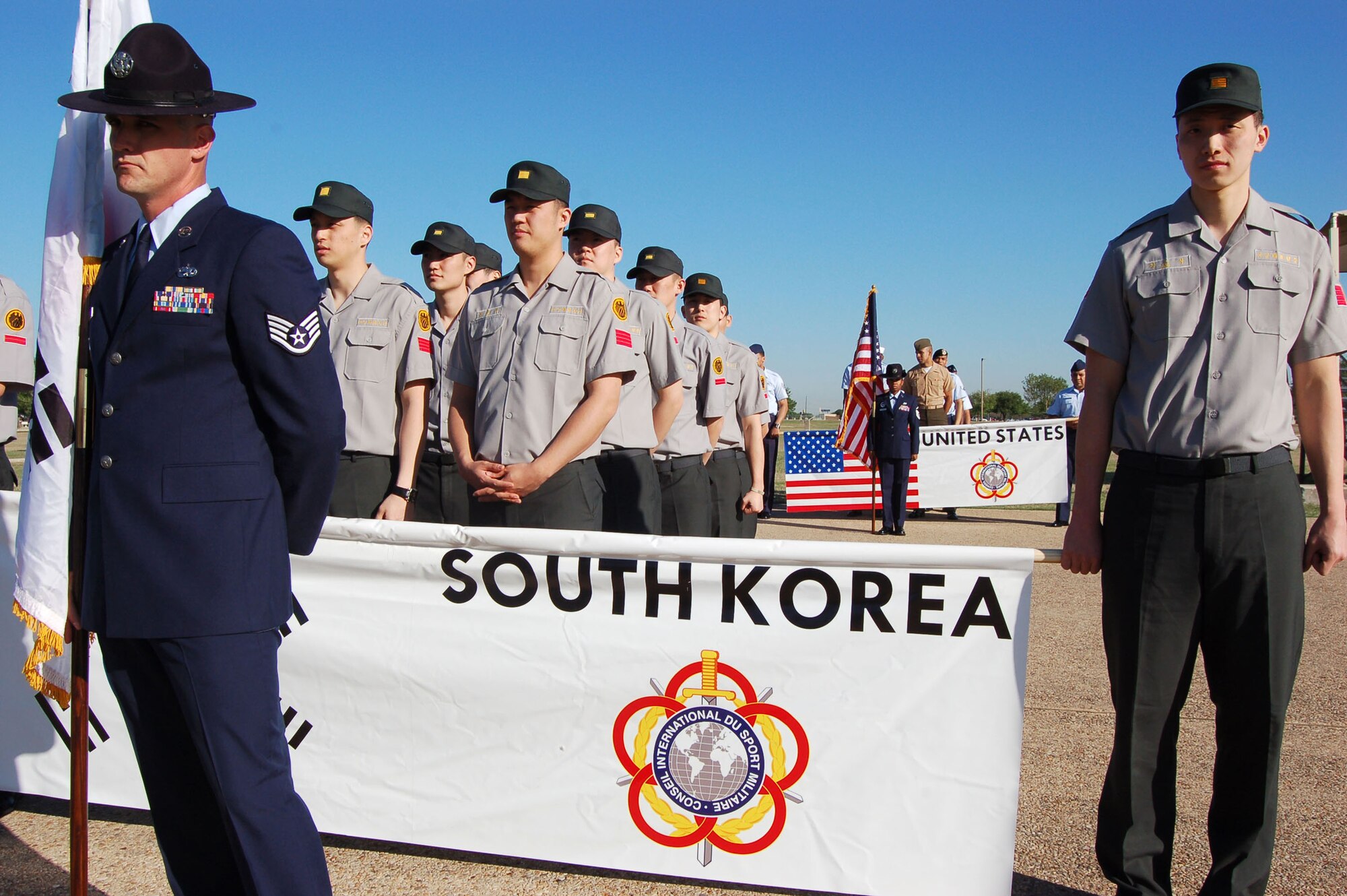 A team of South Korean basketball players stands in formation before the opening ceremony of the 2008 International Military Sports Council Basketball Tournament April 14 at Lackland Air Force Base, Texas. The tournament features teams from the United States, Greece, Italy, South Korea, Canada, Latvia and Lithuania. (U.S. Air Force photo/Staff Sgt. Jeremy Larlee) 
