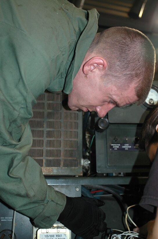 GRISSOM AIR RESERVE BASE, Ind., -- SrA. Zachary Miles, 434th Aerspace Ground Equipment technician, examines a generator heater. The 434th AGE shop's main function's is to troubleshoot, test, repair, modify and overhaul equipment and components. AGE has adopted the slogan "There is no air power without ground power."  (U.S. Air Force photo/ Senior Airman Carl Berry)