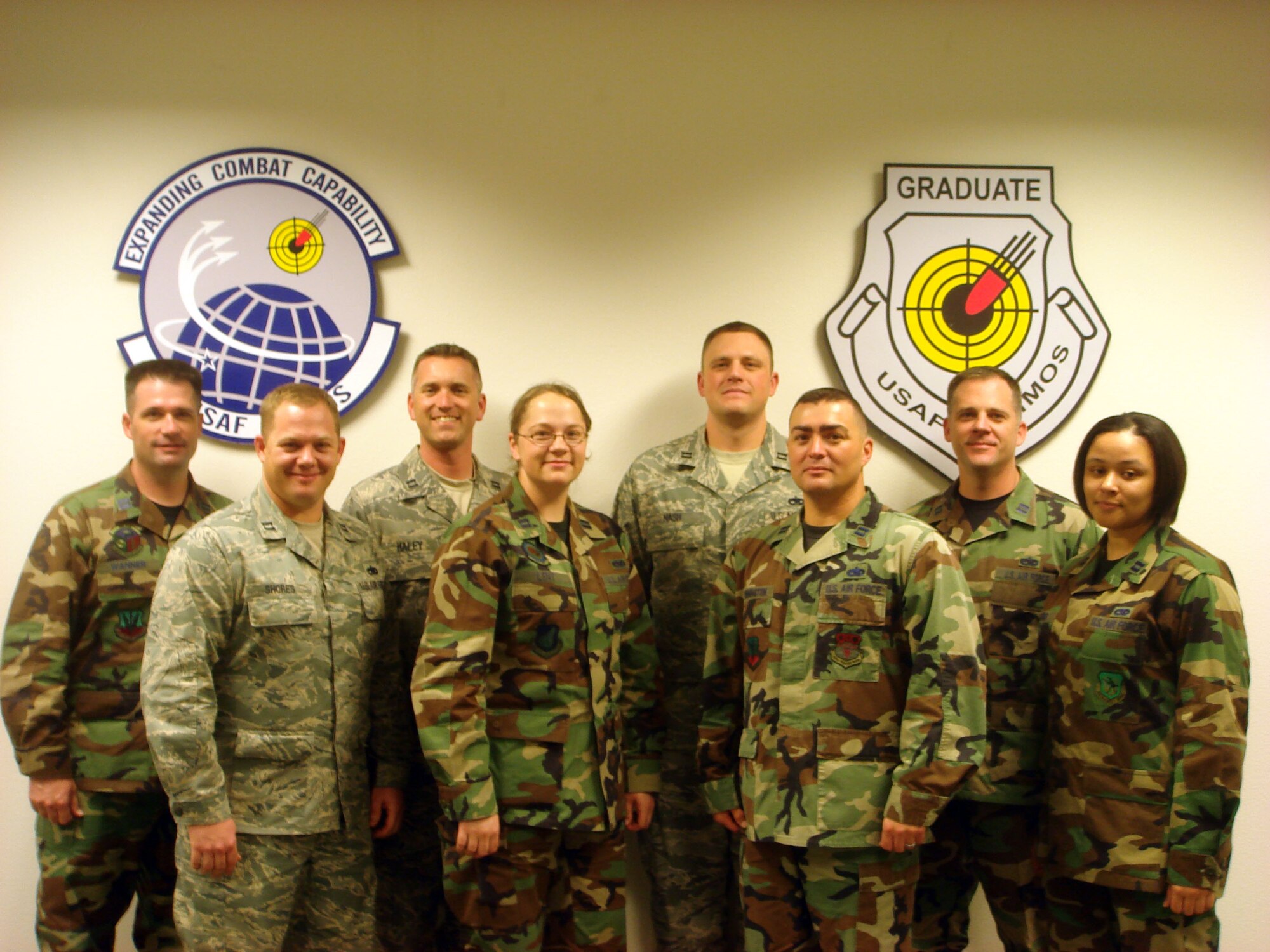 Captain Terry Wanner, Capt. Len Shores, Capt. Chris Haley, Capt. Mary Lent, Capt. Ryan Nash, Capt. Buck Pennington, Capt. Casey Crabill, Capt. Nevah Jones, all Class 08A U.S. Air Force Advanced Maintenance and Munitions Officer School graduates, completed the course April 17.  USAF AMMOS is celebrating five years of training graduate-level maintenance and munitions experts. (courtesy photo)