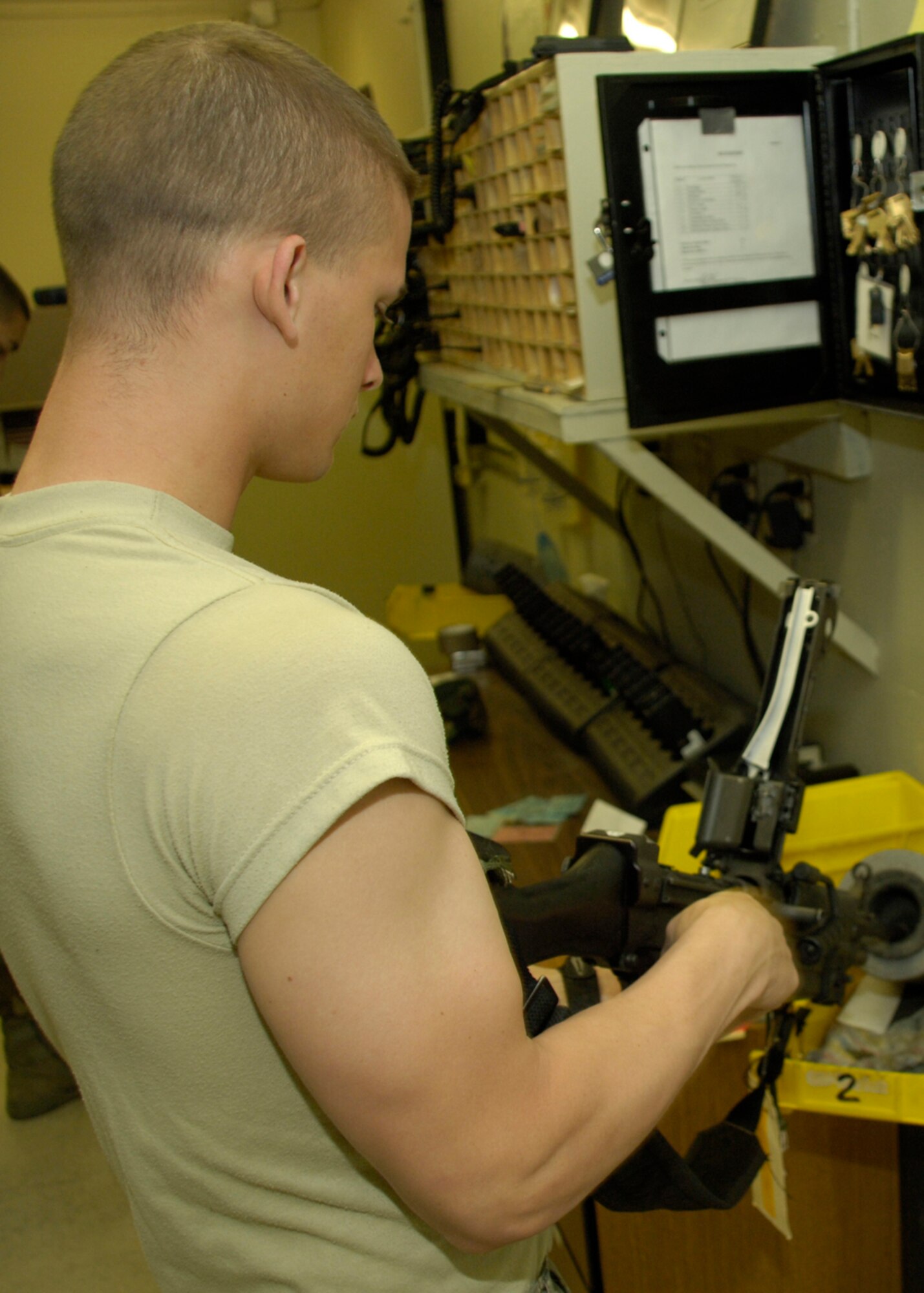 HOLLOMAN AIR FORCE BASE, N.M. -- Senior Airman Jeremy Grizzle, an armorer from the 49th Security Forces Squadron,  clears and visually inspects a 5.56 mm M-4 carbine rifle at the armory here April 15. The 49 SFS provides force protection programs to include weapon system security, police services, resource protection and antiterrorism for the 49th Fighter Wing. They also maintain a wartime and contingency rapid deployment capability to conduct force protection operations worldwide. (U.S. Air Force photo/Airman 1st Class Michael J. Means) 