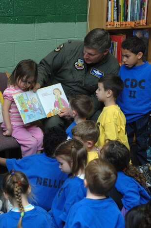Col. Michael Bartley, 99th Air Base Wing commander, spends an afternoon reading at the base library to children from the child development center in recognition of April’s “The Month of the Military Child”, April 2,2008.(U.S. Air Force photo/Senior Airman Nadine Y. Barlcay)