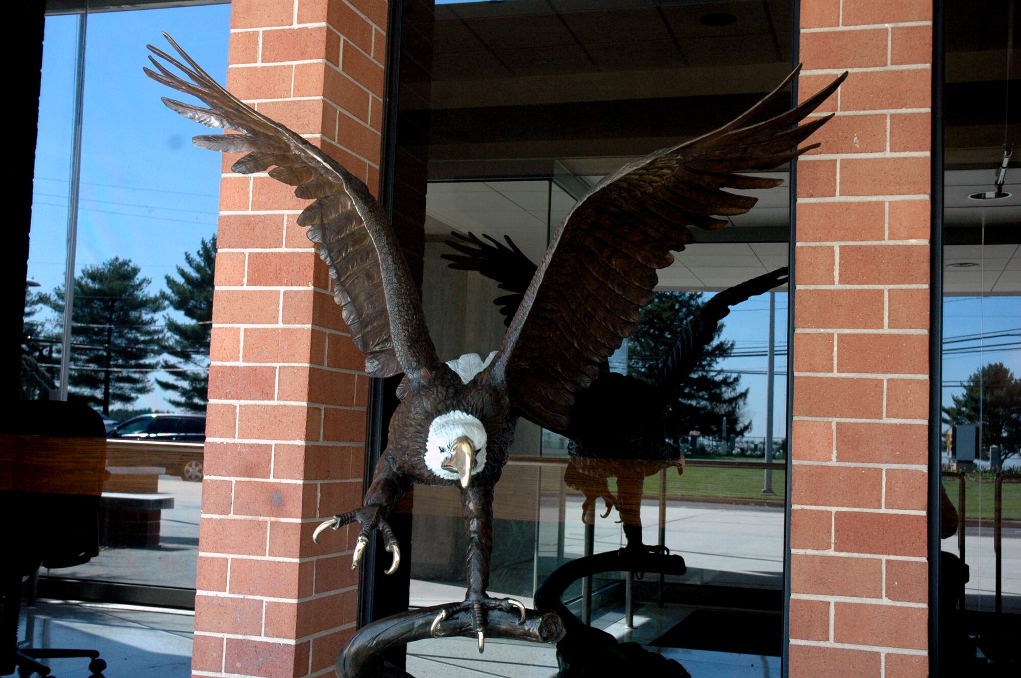 This statue of an eagle landing on its perch has found a home in the entry way to the U.S. Air Force Expeditionary Center on Fort Dix, N.J.  Designed by artist Jules Moignez, the statue has been named "Liberty" or "Libby" for short.  The statue represents the USAF EC's moniker, the "Eagles."  (U.S. Air Force Photo/Tech. Sgt. Scott T. Sturkol)