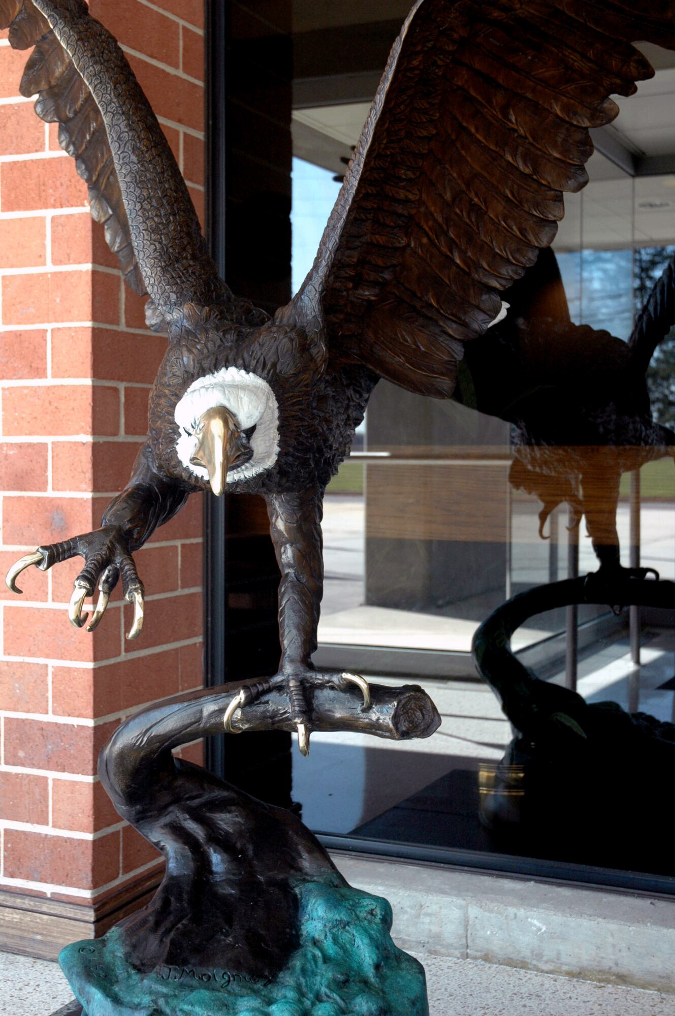 This statue of an eagle landing on its perch has found a home in the entry way to the U.S. Air Force Expeditionary Center on Fort Dix, N.J.  Designed by artist Jules Moignez, the statue has been named "Liberty" or "Libby" for short.  The statue represents the USAF EC's moniker, the "Eagles."  (U.S. Air Force Photo/Tech. Sgt. Scott T. Sturkol)
