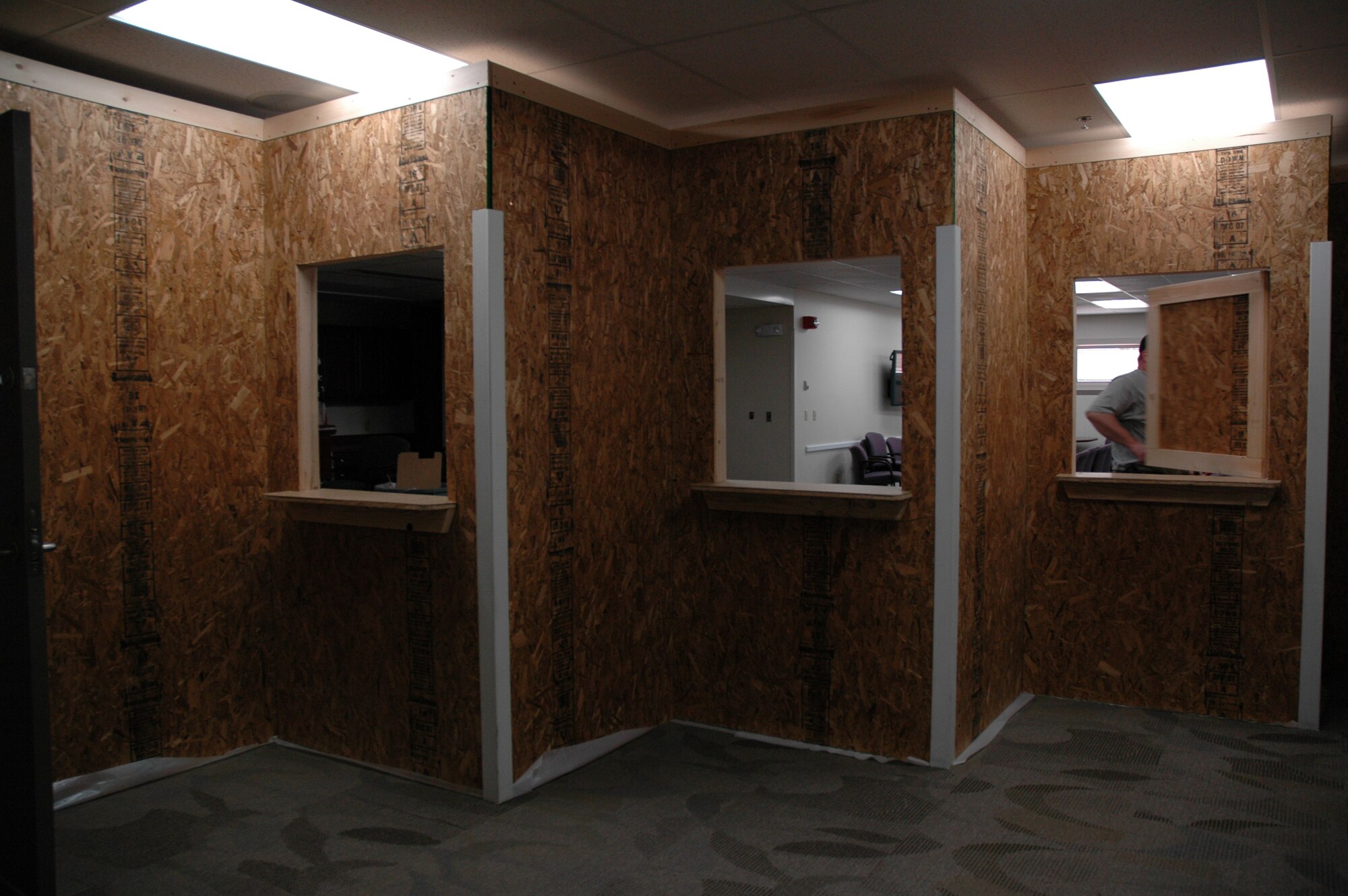 The new, four-window pharmacy construction is currently underway in the Chief Schuab Assembly Room at the East Entrance of the clinic. The new pharmacy will help ensure privacy and efficiency for getting prescriptions filled. With all the new rennovations going on at the clinic, patients are encouraged to look at the signs posted throughout the clinic or ask Medical Group personnel for directions. (U.S. Air Force photo/Airman 1st Class Emerald Ralston)